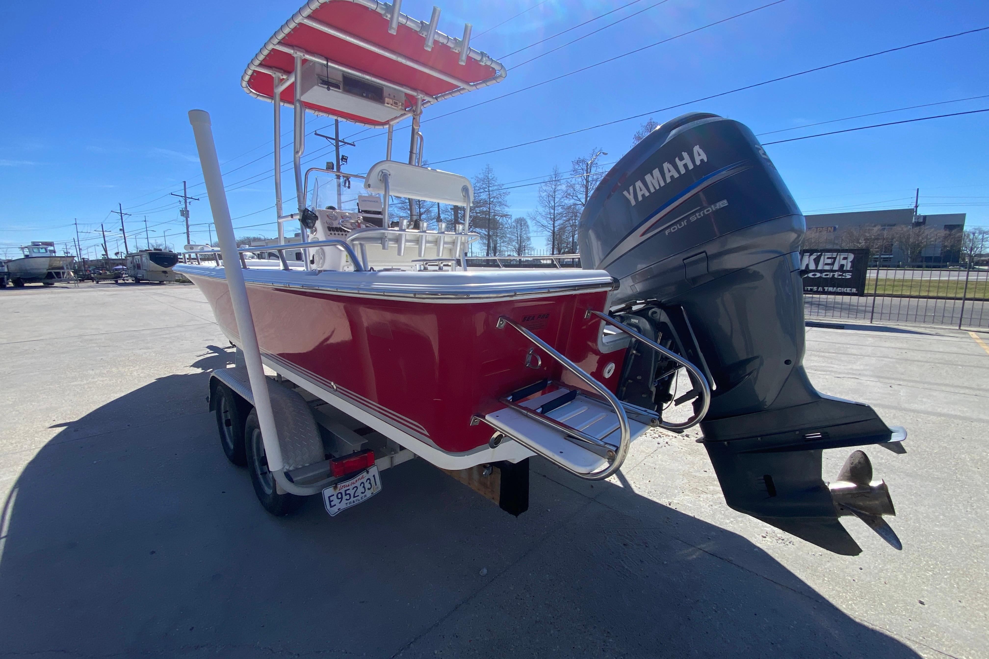 2005 Sea Pro SV2400CC Bay Boat with Yamaha engine on trailer, sunny day.
