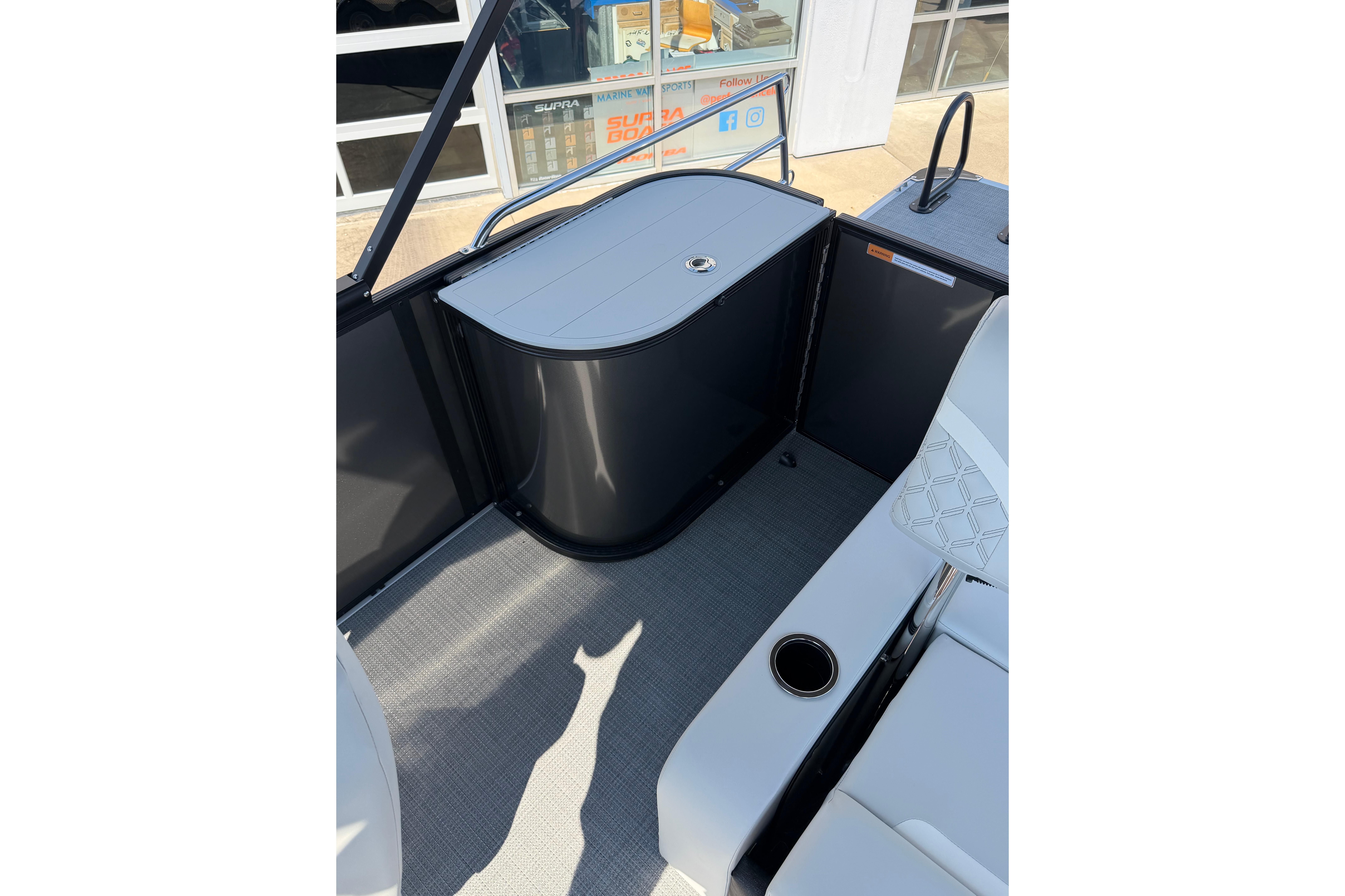 2026 Crest Conquest 250 SLSC boat interior with seating and storage area.