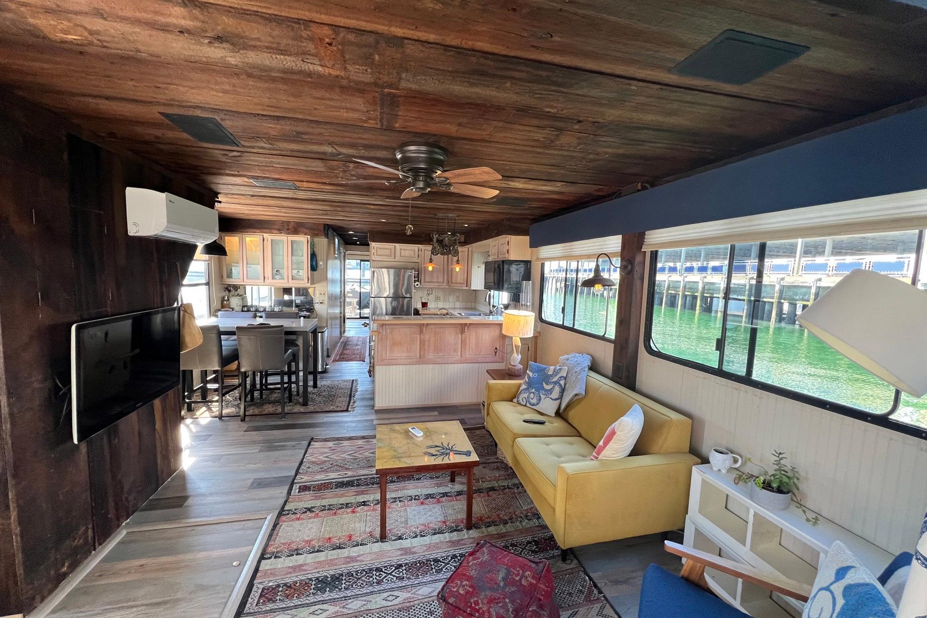 Interior of a 1993 Sumerset houseboat with cozy living area and kitchen.