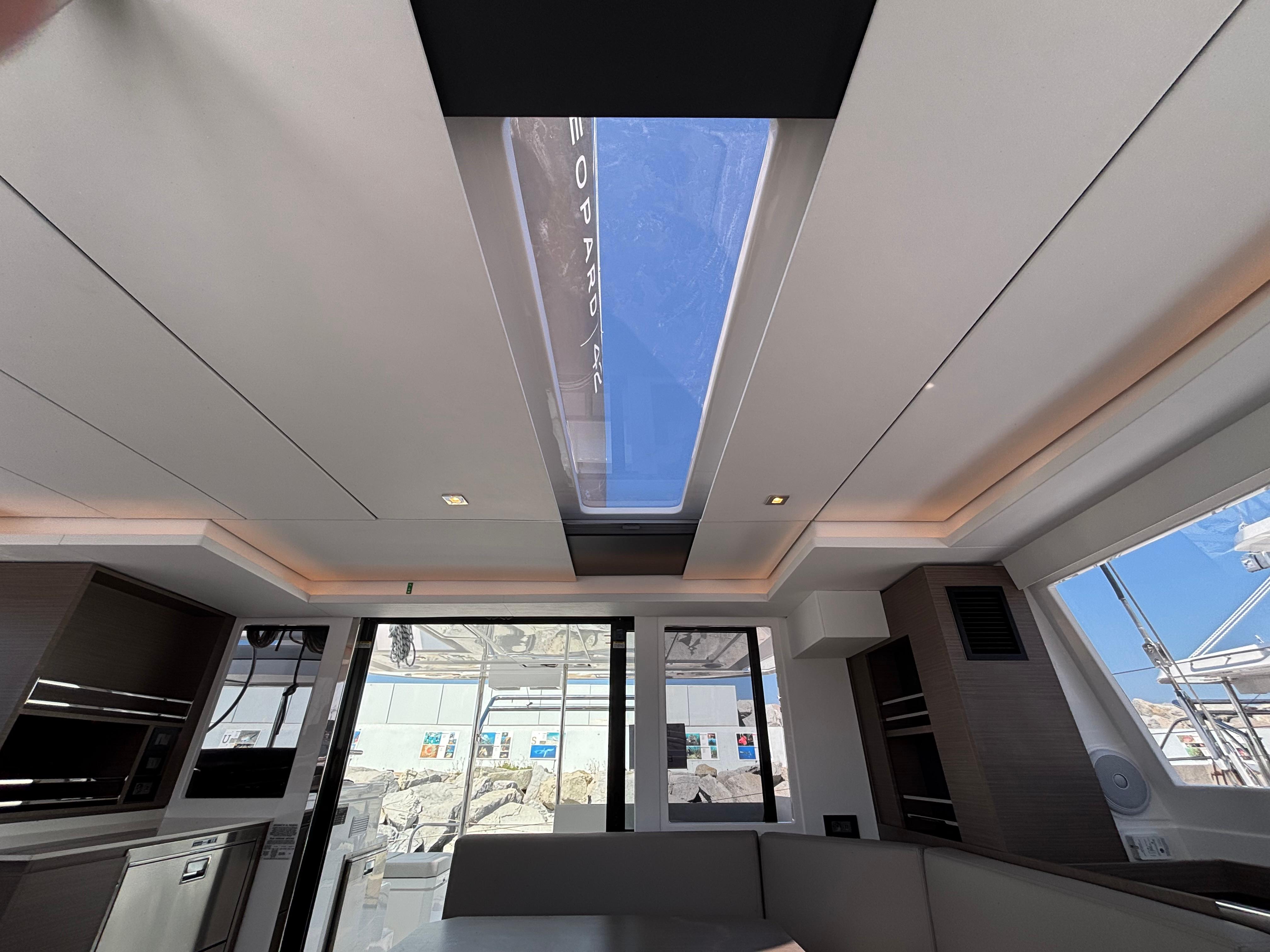 Interior of 2025 Leopard 42 yacht with modern design and skylight.