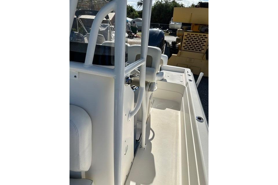 2014 ShearWater 25 LTD boat interior with seating and railing, parked outdoors.
