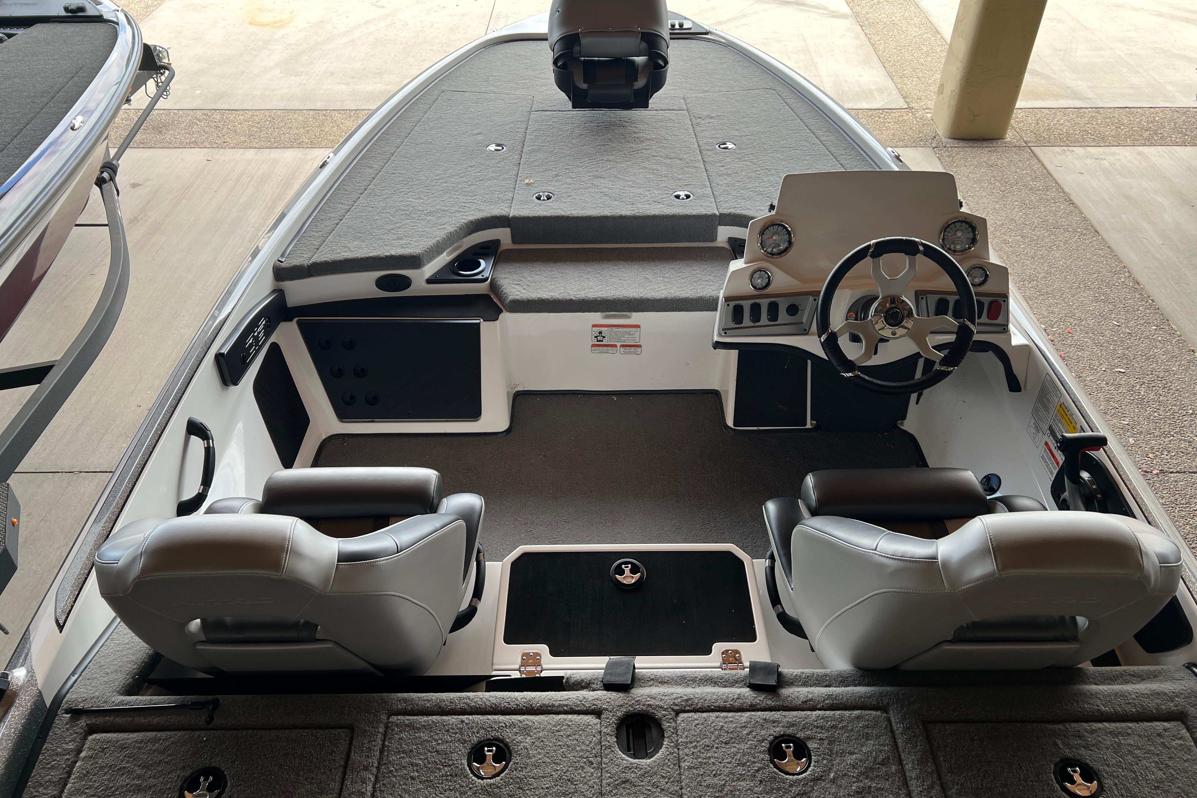 2026 Nitro Z19 XL Pro boat interior with steering wheel and seating.