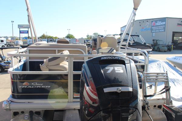 2024 Sun Tracker BB18 pontoon boat with Mercury 75 engine at dealership.