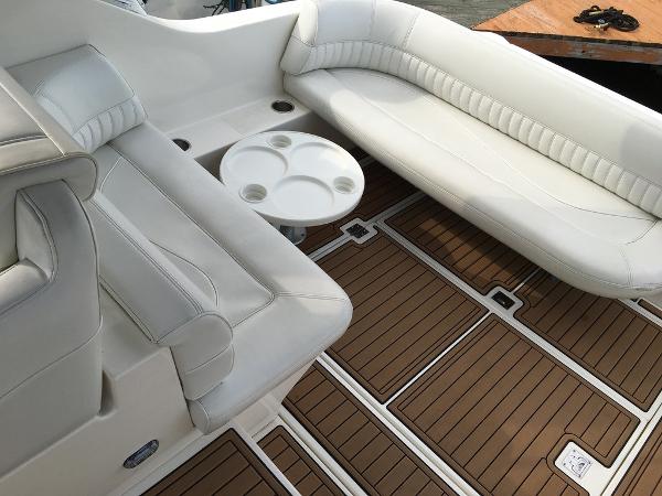 Interior of a 2004 Cruisers Yachts 3372 Express with white seating.