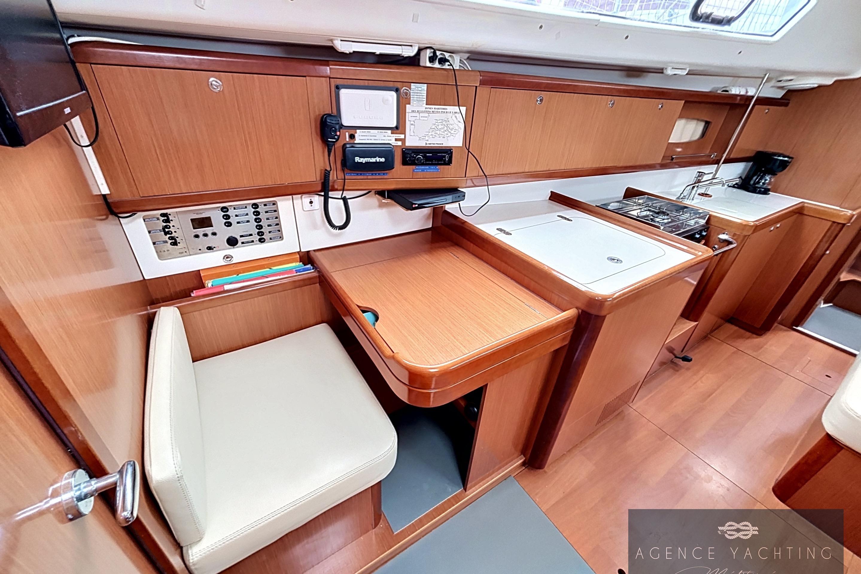 Interior of 2008 Beneteau Oceanis 40 yacht with navigation station and galley.