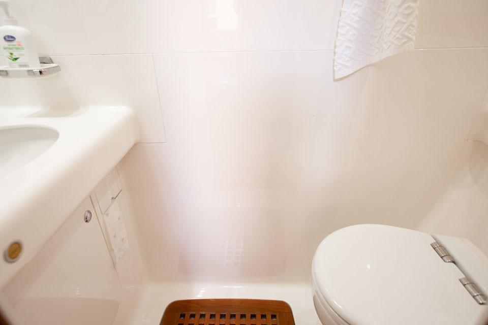 Bathroom interior of 2001 Nautor Swan 80 yacht, featuring sink and toilet.