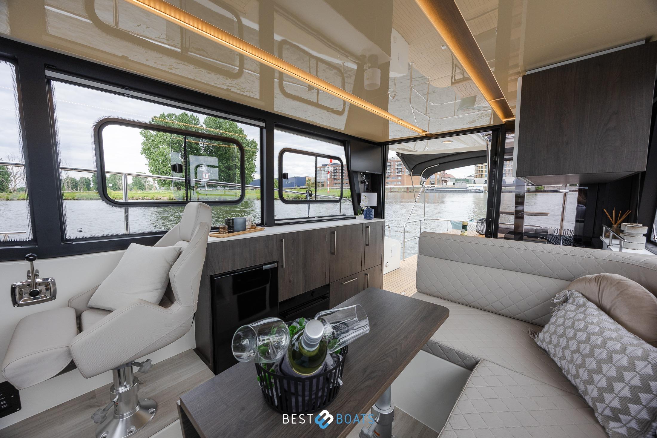 Luxurious interior of 2023 Cobra Yachts Futura 36 Premium Fly, featuring modern seating and scenic views.