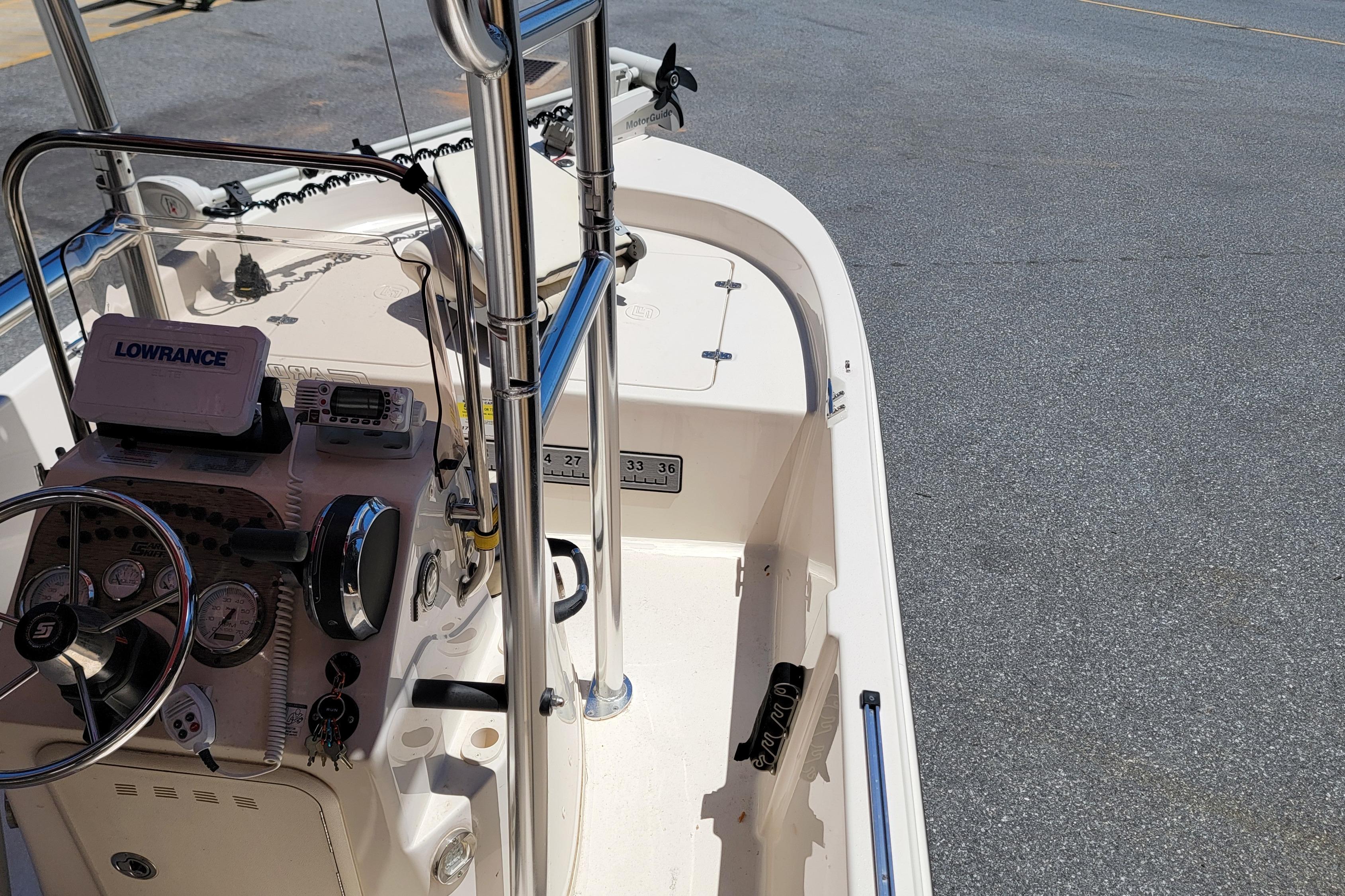 2021 Carolina Skiff 178 JLS boat interior with steering console and navigation equipment.