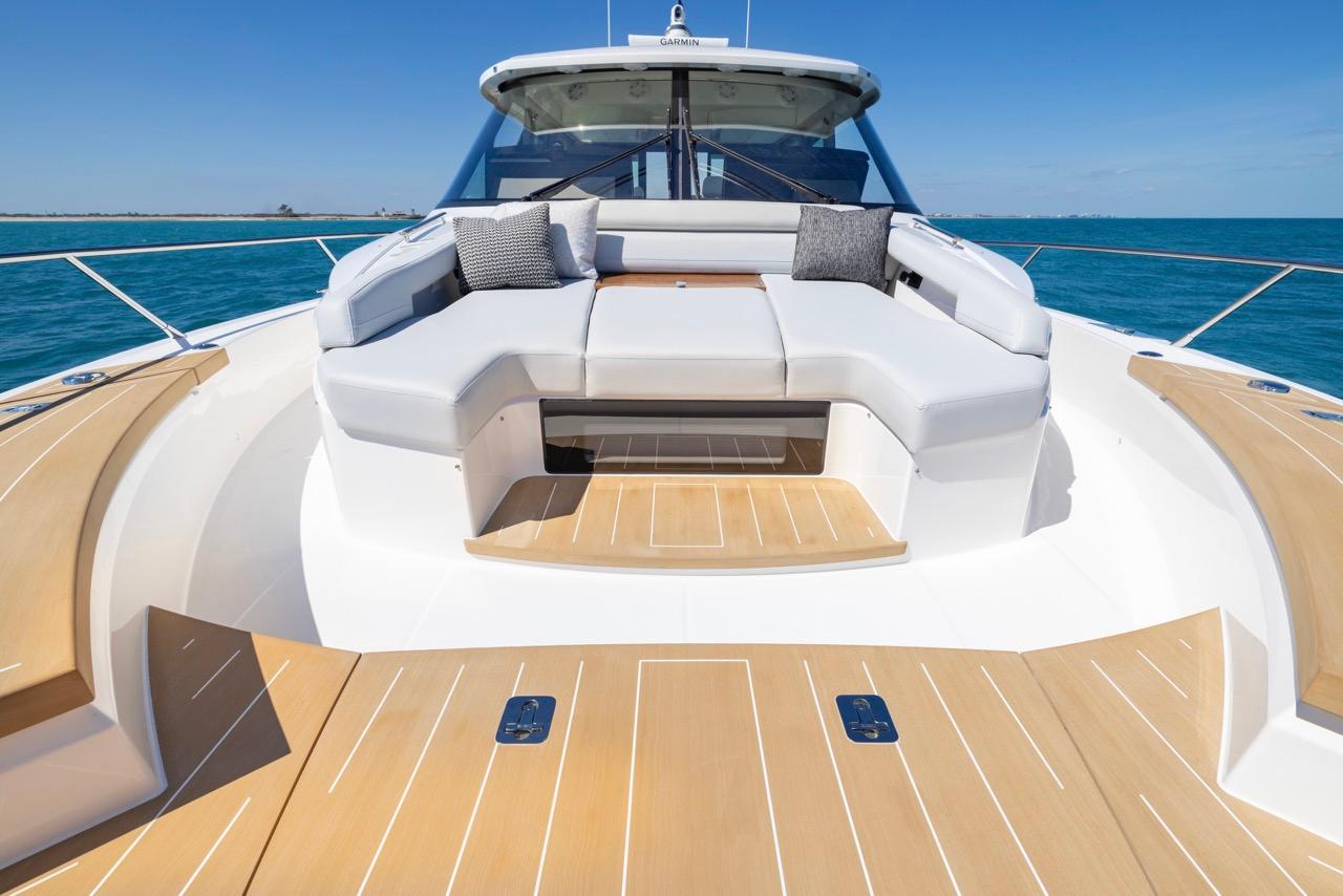 Luxurious 2025 Tiara Yachts EX 54 with spacious deck seating and ocean view.