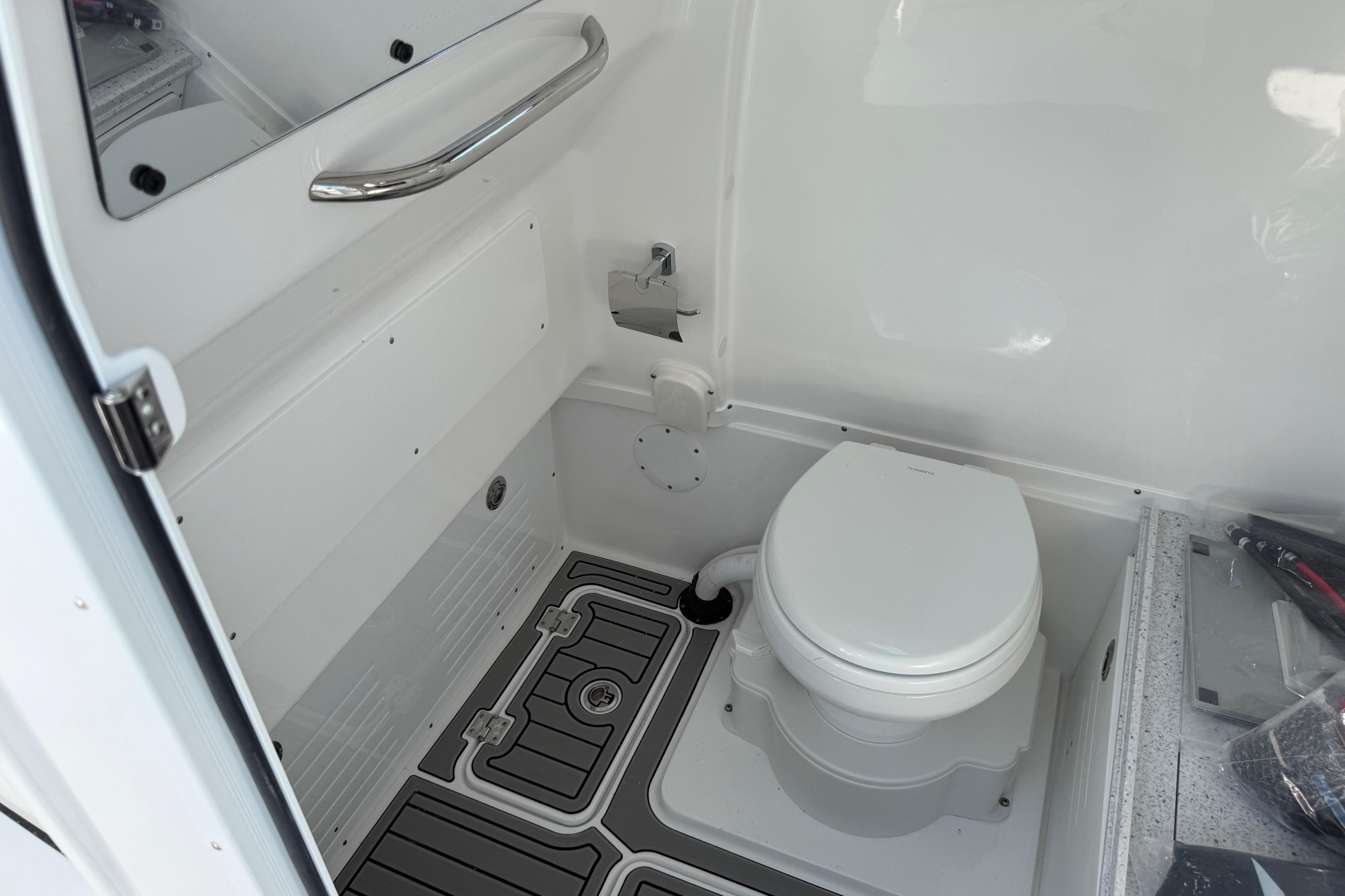 2026 Tidewater 3100 Carolina Bay boat interior with modern marine toilet and sleek design.