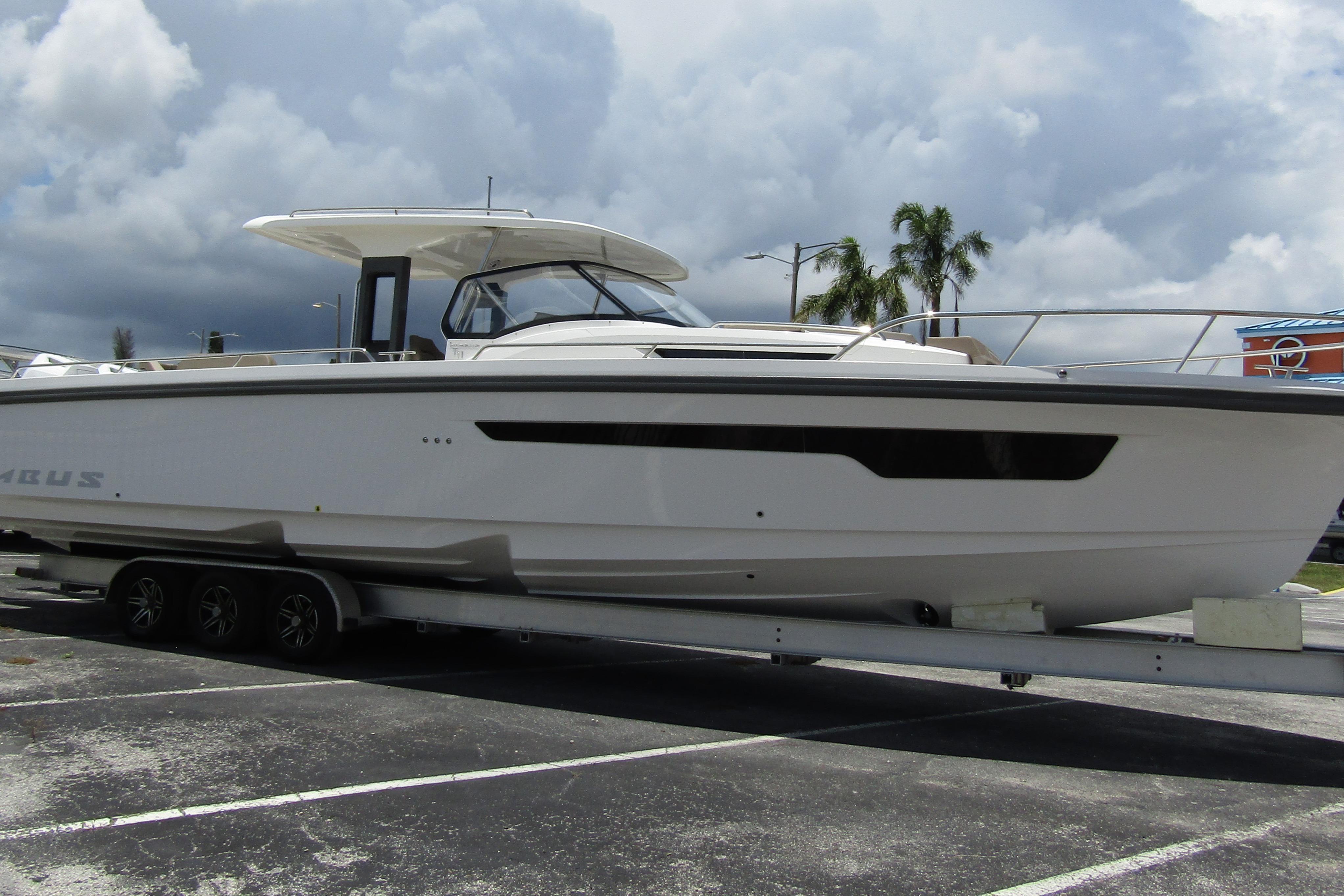 2025 Nimbus Tender 11 boat on trailer under cloudy sky, parked in lot.