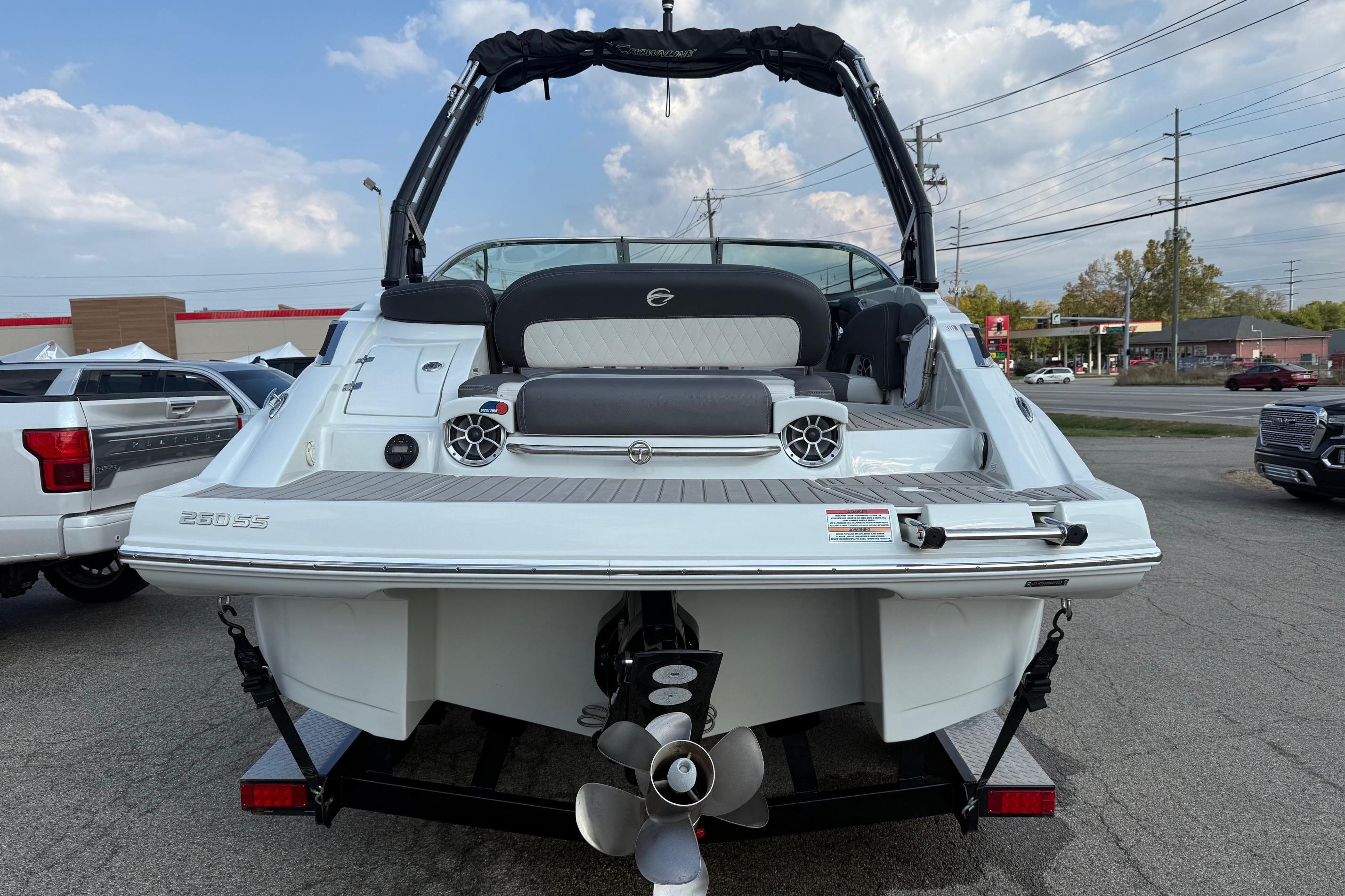 2023 Crownline 260 SS boat rear view, showcasing sleek design and powerful engine.