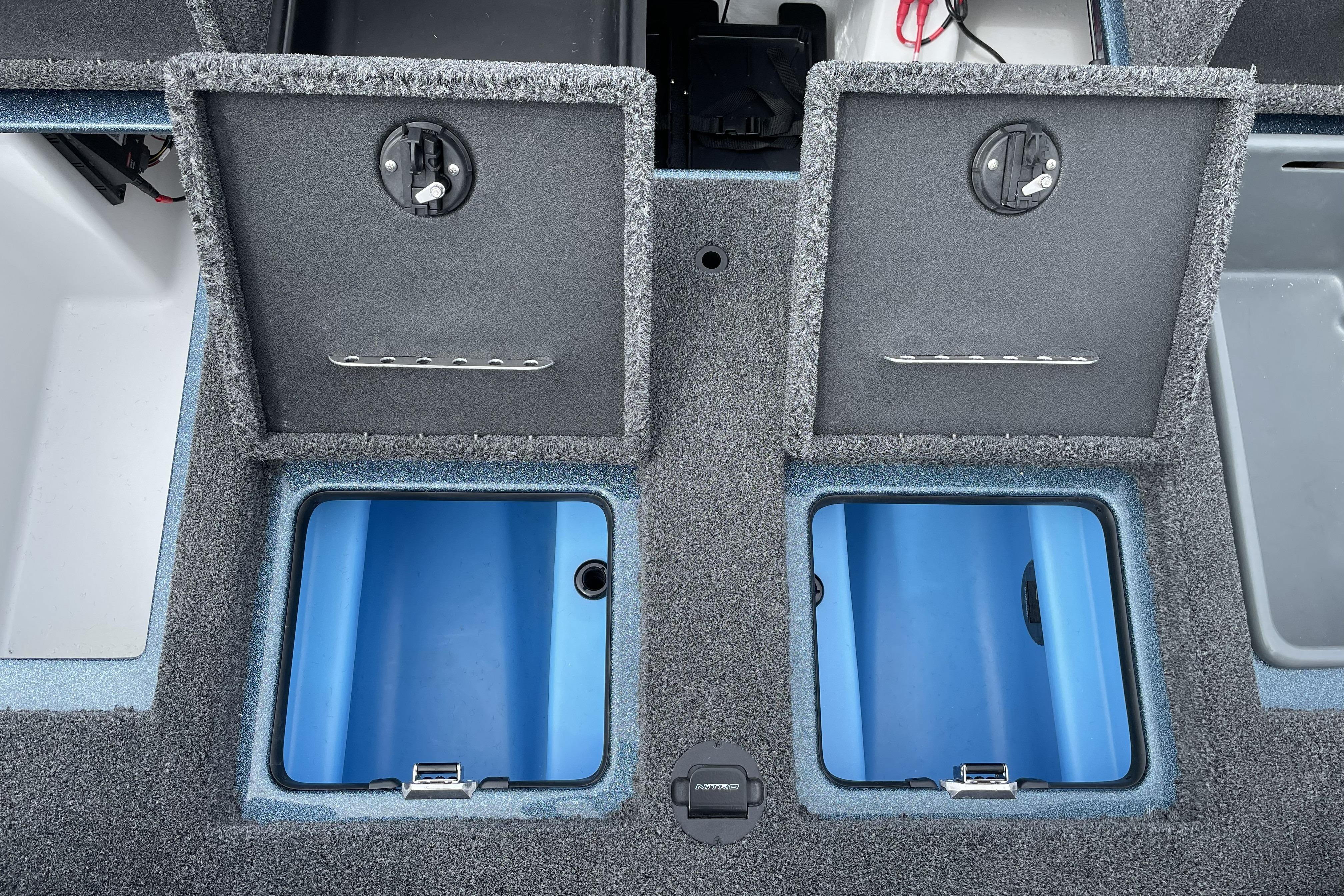 2026 Nitro Z21 XL boat storage compartments with open lids, showcasing interior design.