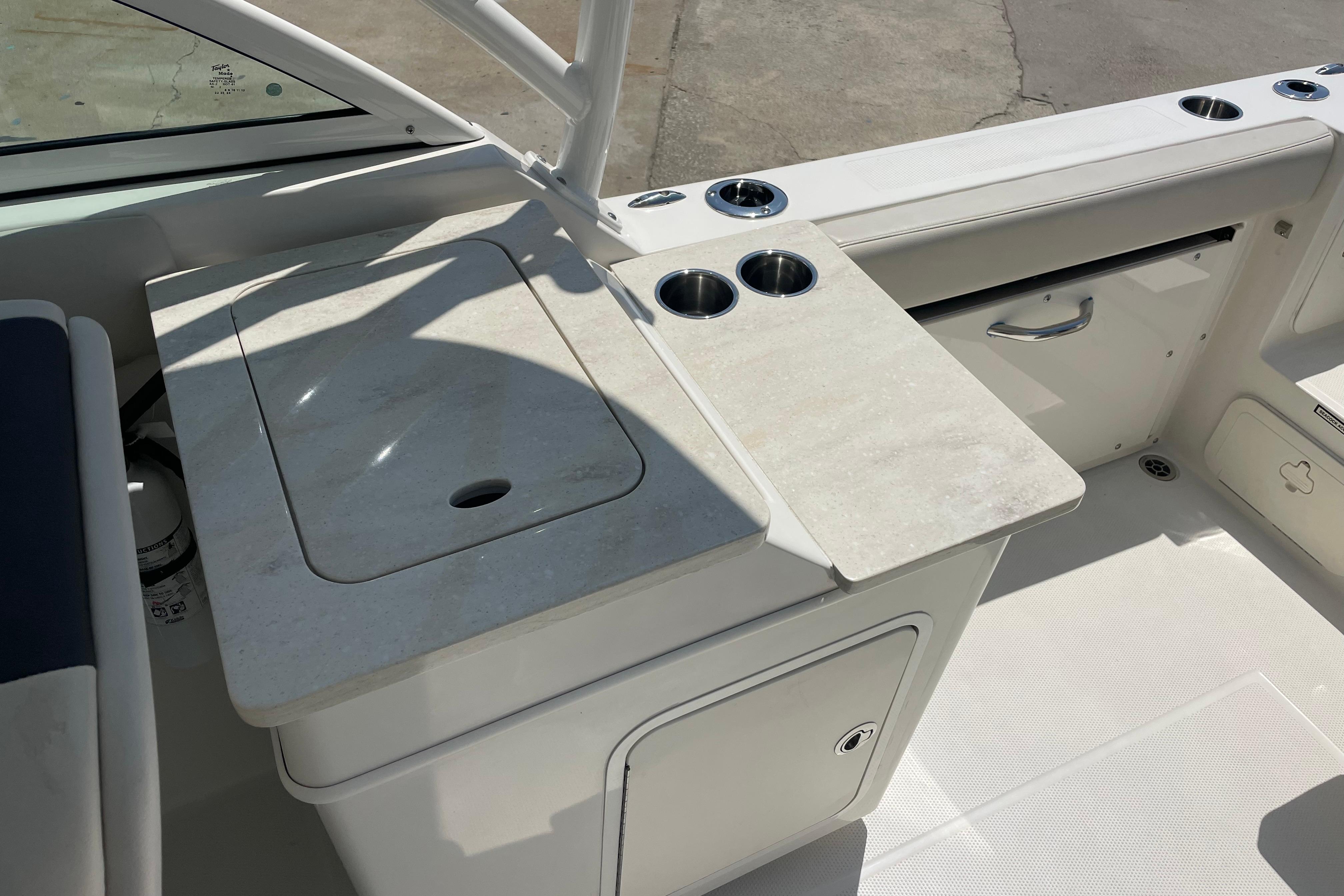 2022 Sailfish 245 DC boat interior with countertop and cup holders.