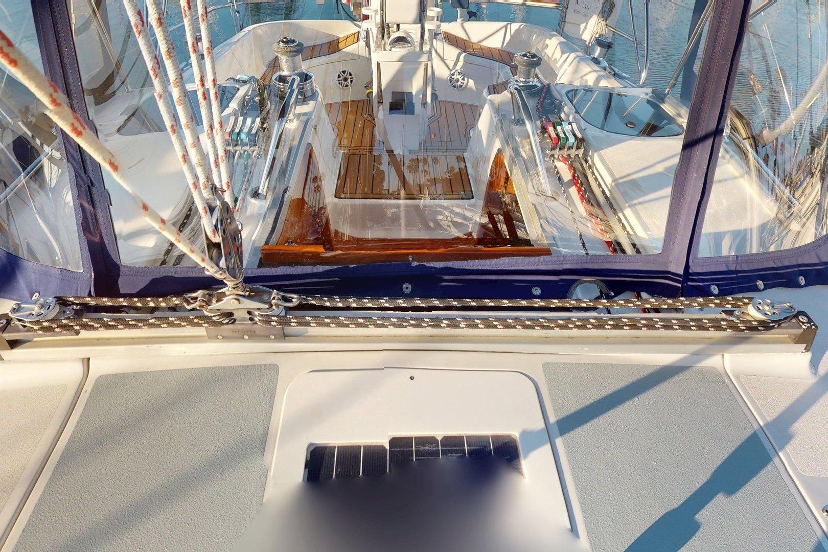 Cockpit view of a 1997 Hunter Legend 40.5 sailboat with ropes and winches.