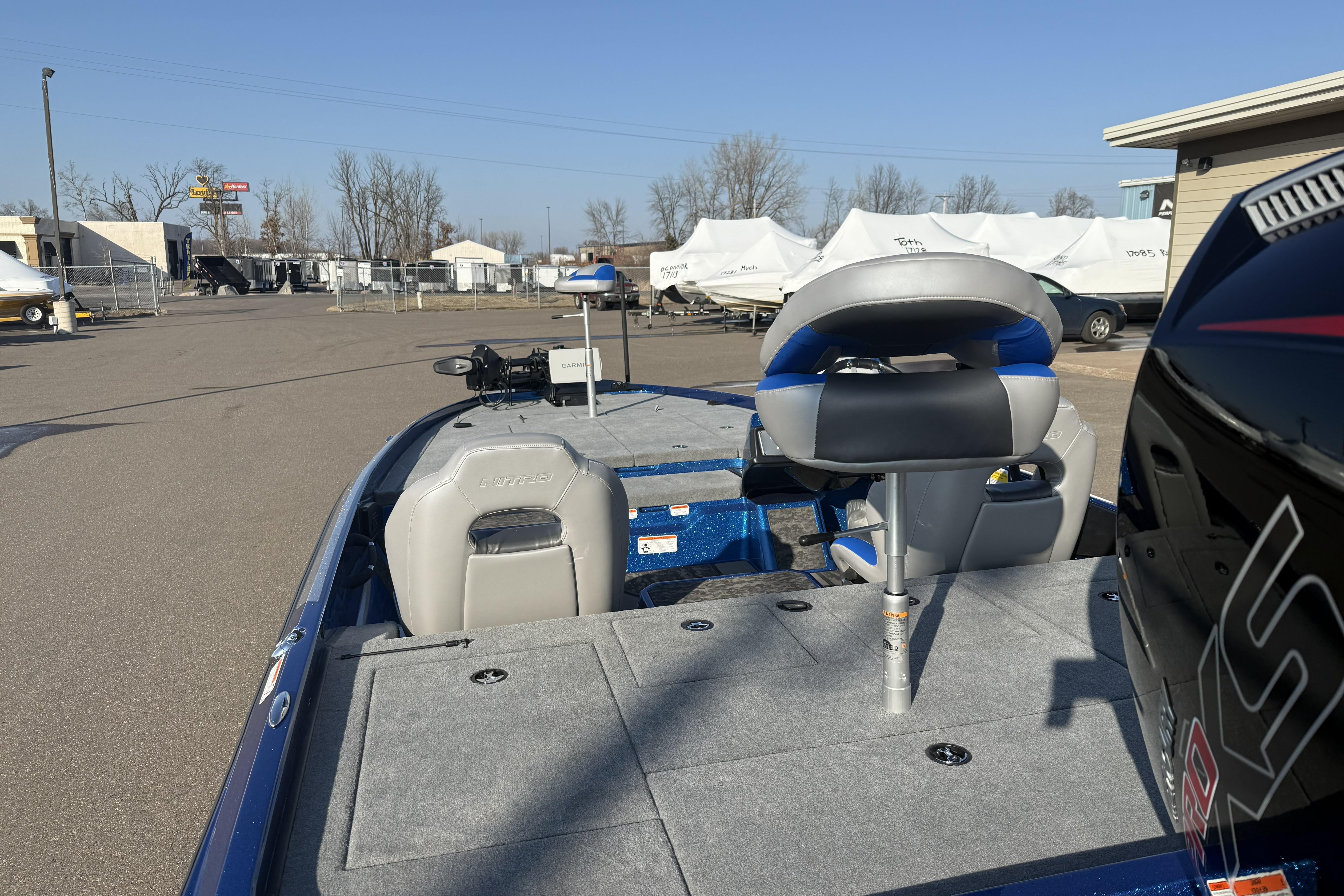 2026 Nitro Z21 XL Pro boat with seating and equipment, parked outdoors.