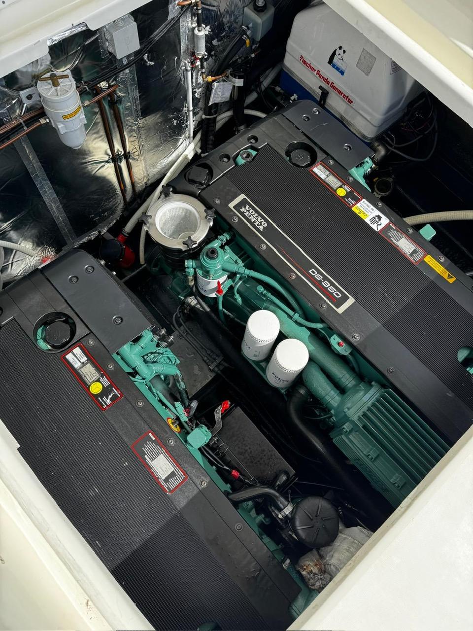 Engine compartment of 2006 Cranchi Endurance 41, showcasing dual Volvo Penta engines.