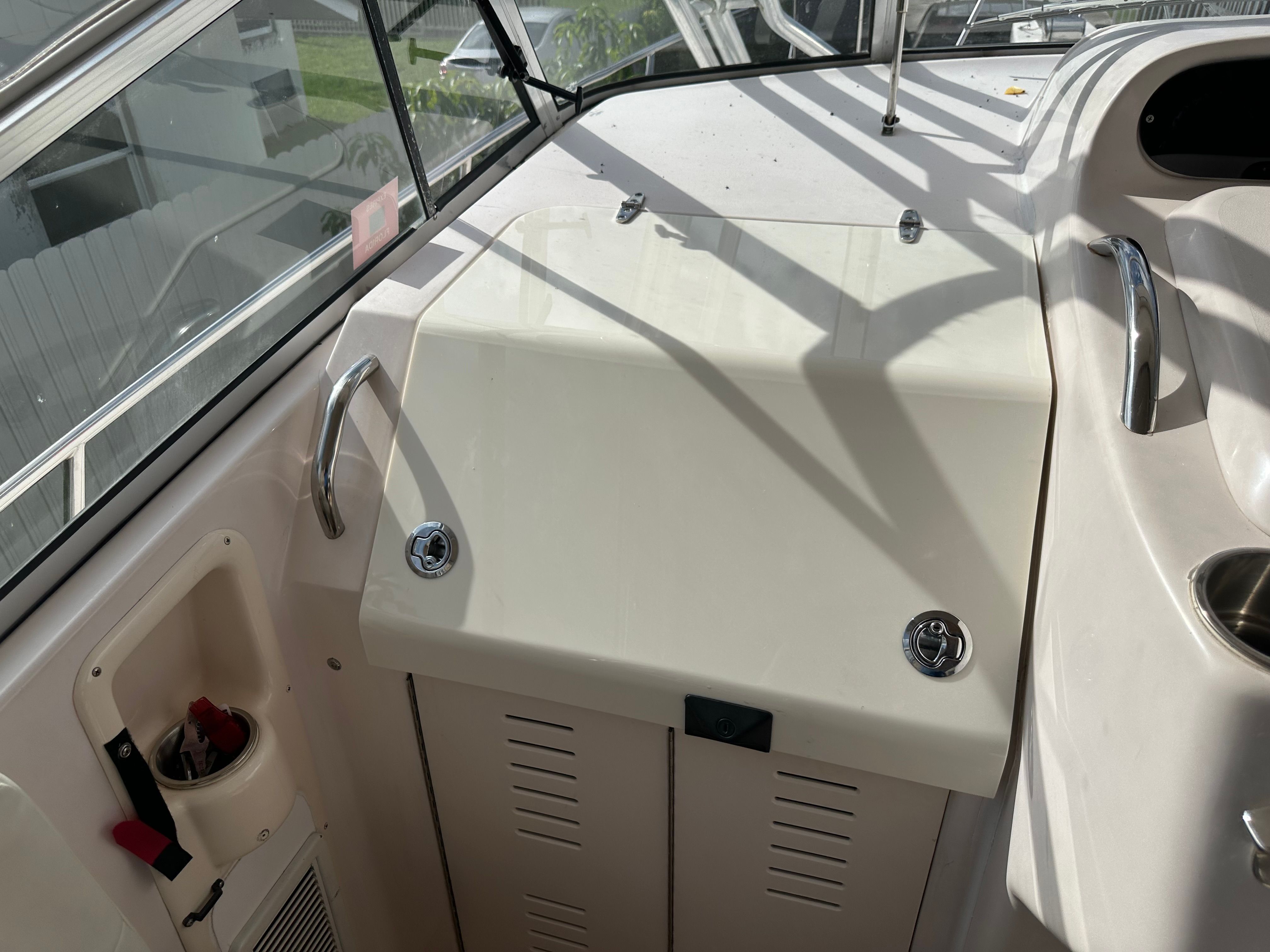 The image shows the cockpit of a 2003 Grady-White Express 330 with a helm console.