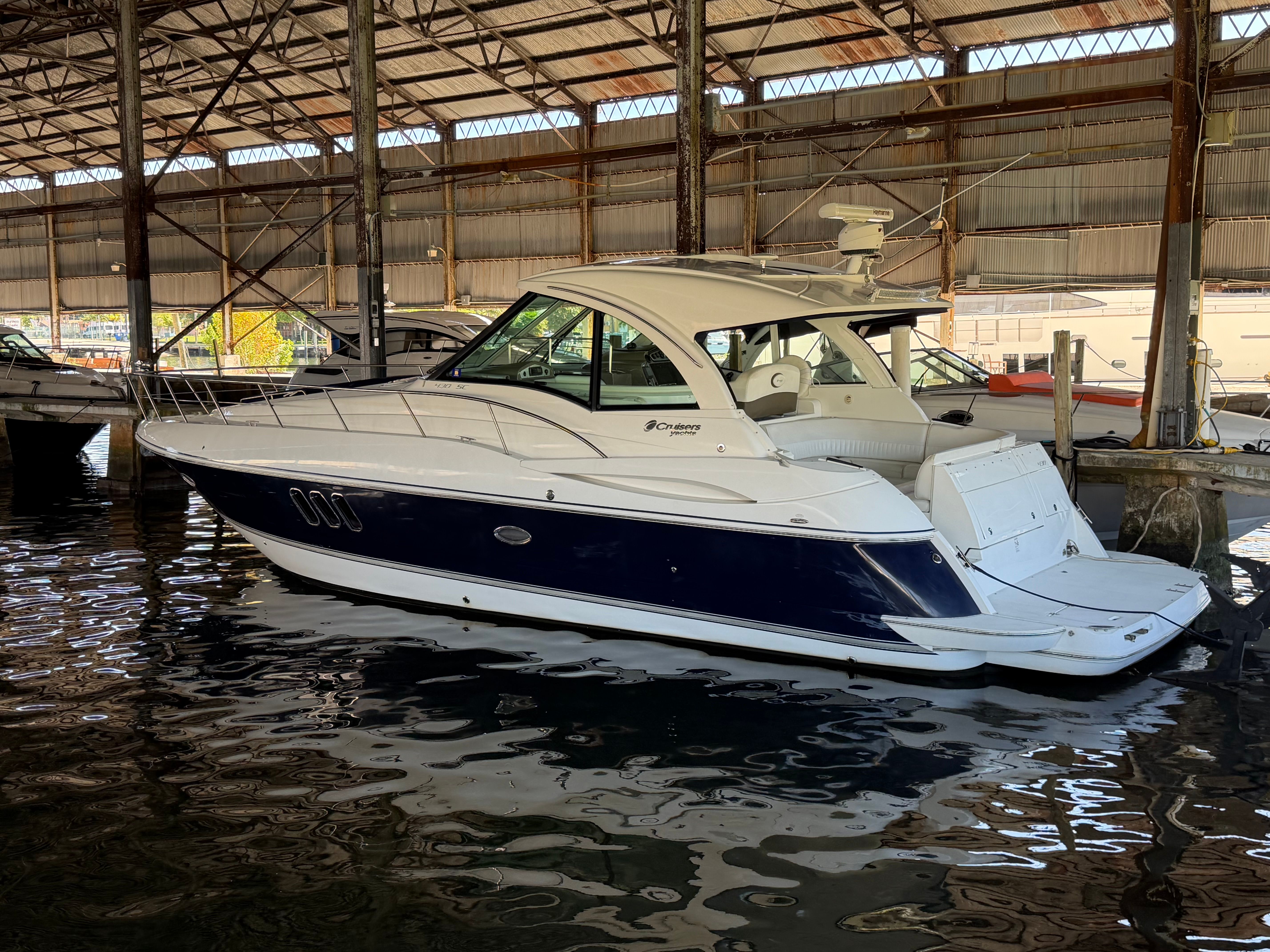 2012 Cruisers Yachts 430 Sports Coupe in a covered marina.