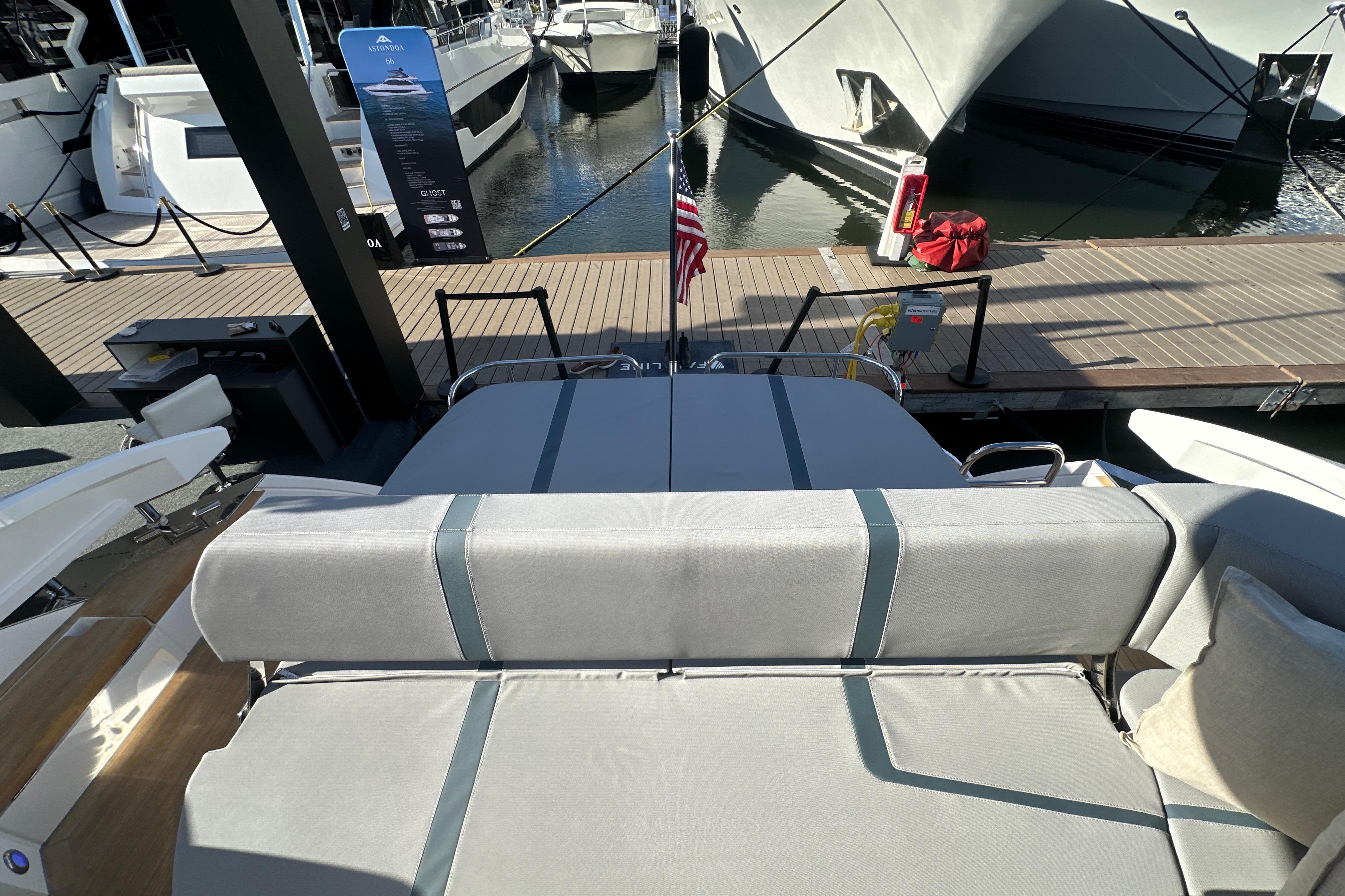 Luxury Fairline Targa 47 GT yacht interior, showcasing elegant seating and dockside view.