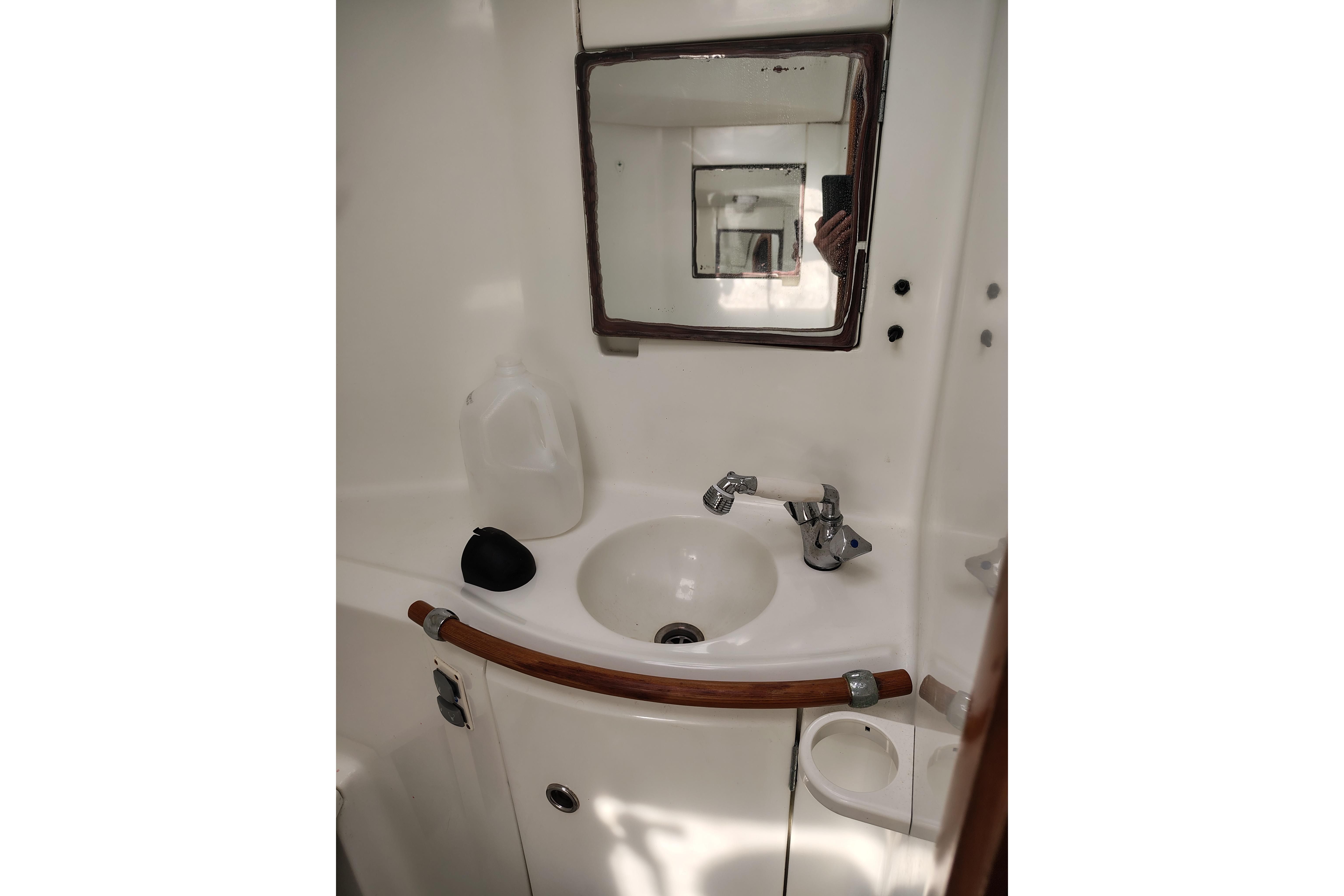 Bathroom sink area in a 2001 Beneteau Oceanis 411 yacht.