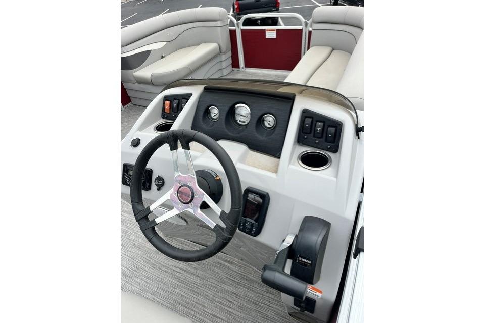 2021 Bennington 205SL boat dashboard with steering wheel and control panel.