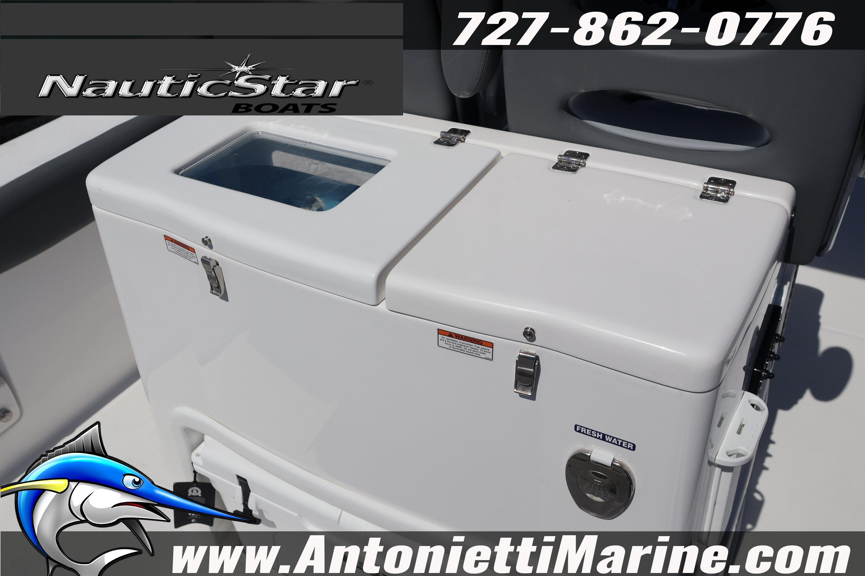NauticStar 292 Legacy 2026 boat cooler with fresh water compartment, contact info displayed.