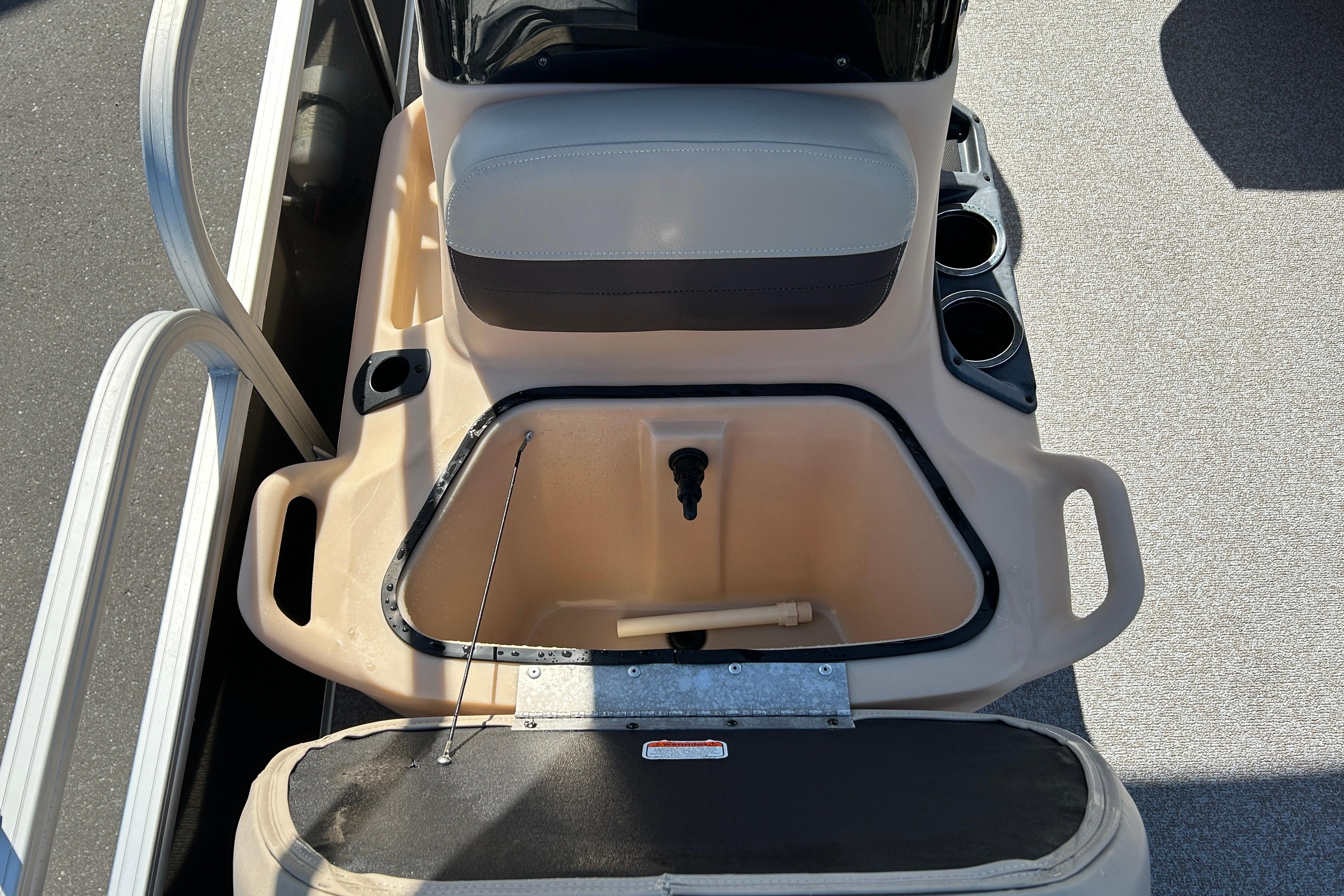 2017 Sun Tracker Bass Buggy 18 DLX boat interior with storage compartment and seating.