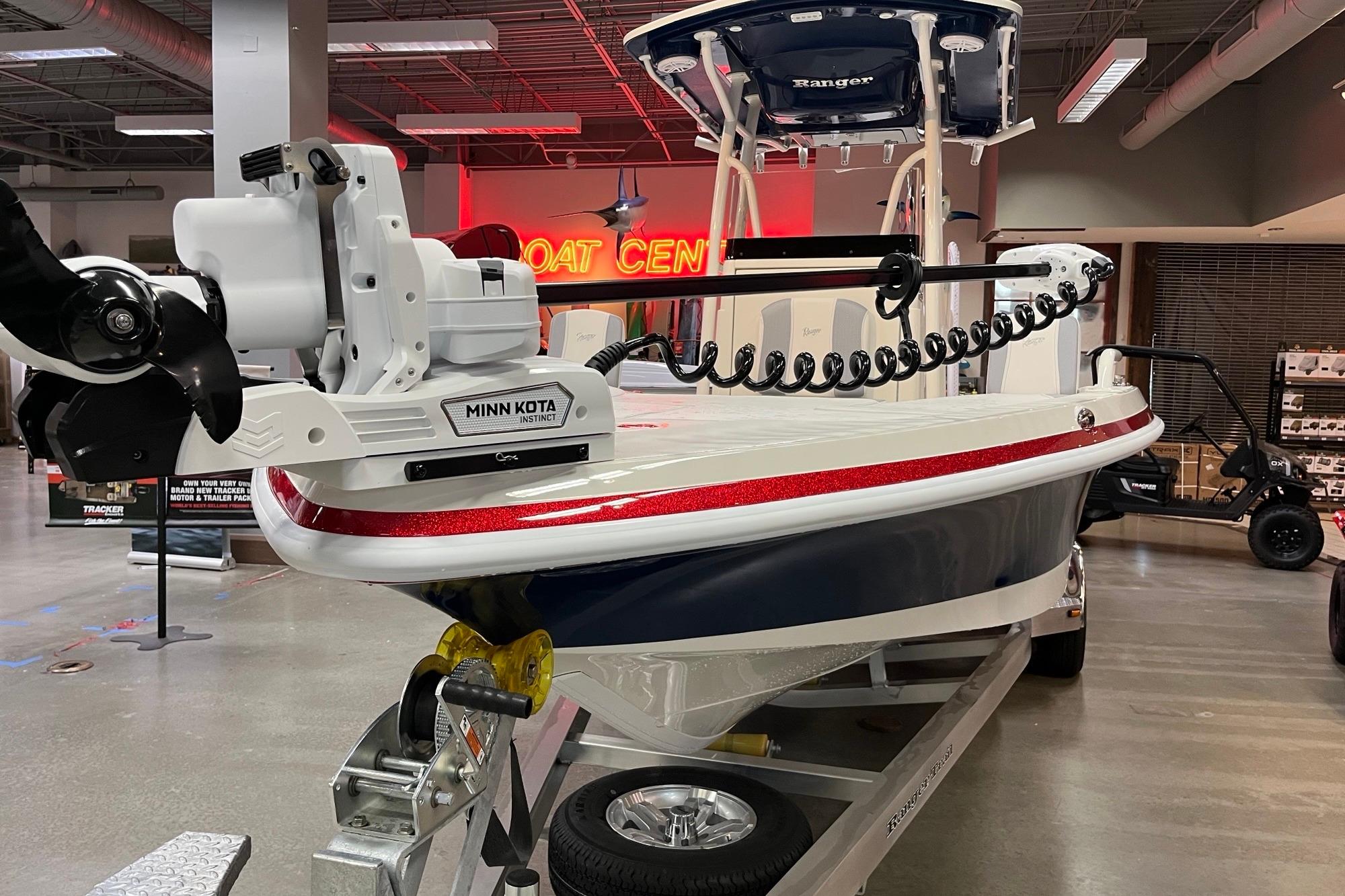 2026 Ranger 2510 Bay boat with Minn Kota motor on display in showroom.