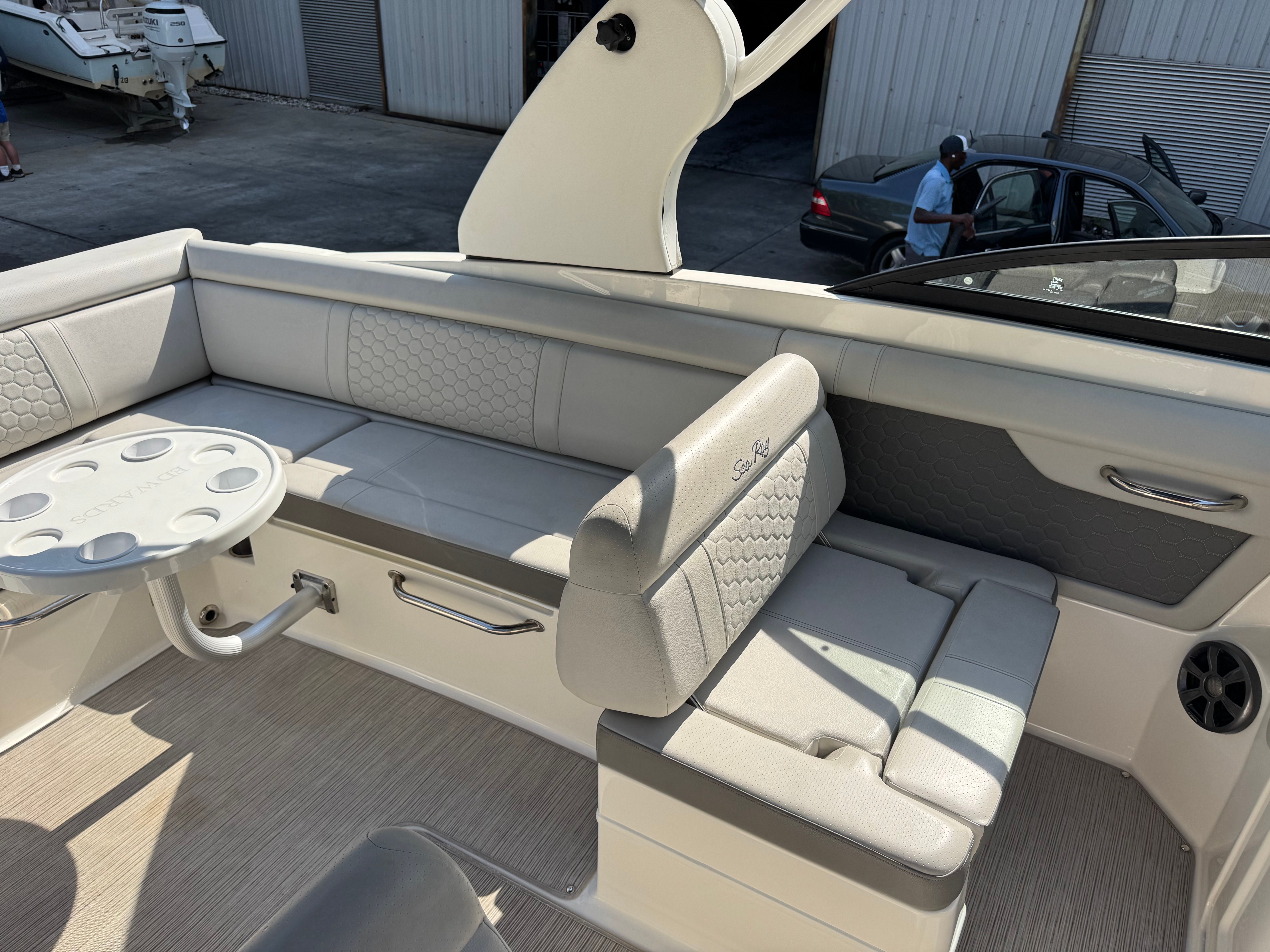Interior of a 2020 Sea Ray SDX 270 Outboard boat with gray upholstery.