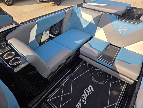 2025 Tigé Z3 boat interior with blue and gray seating, cup holders, and stylish design.