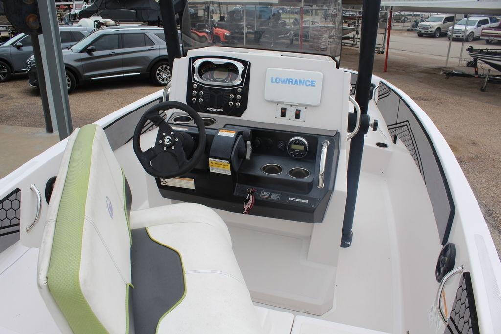 Interior view of a 2017 Scarab 195 boat with steering console and seating.
