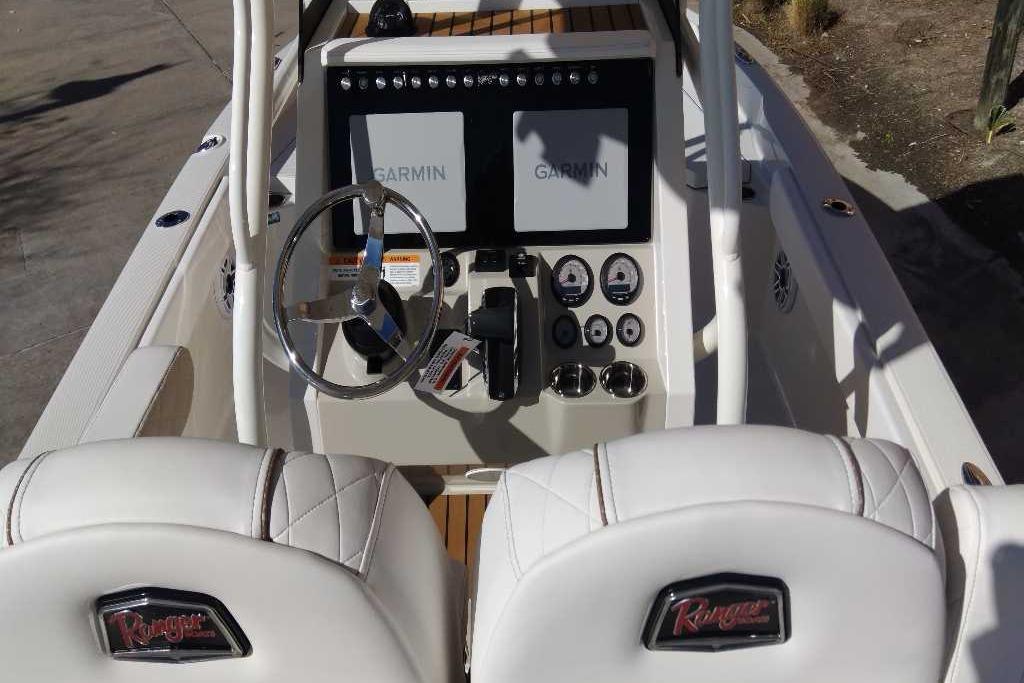 2026 Ranger 2510 Bay boat cockpit with Garmin displays and white leather seats.