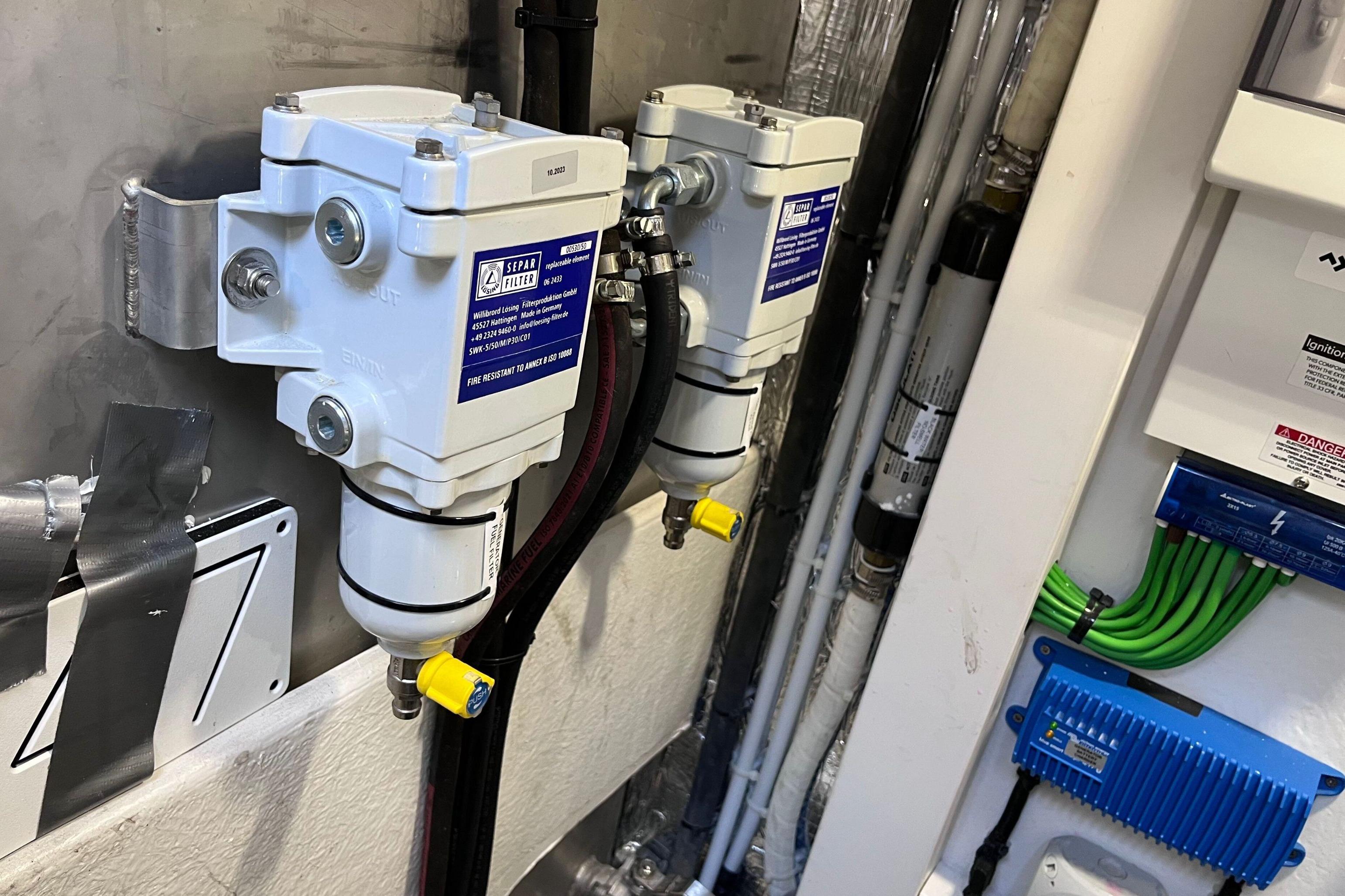Engine room of 2024 Galeon 425 HTS yacht with fuel filters and wiring.