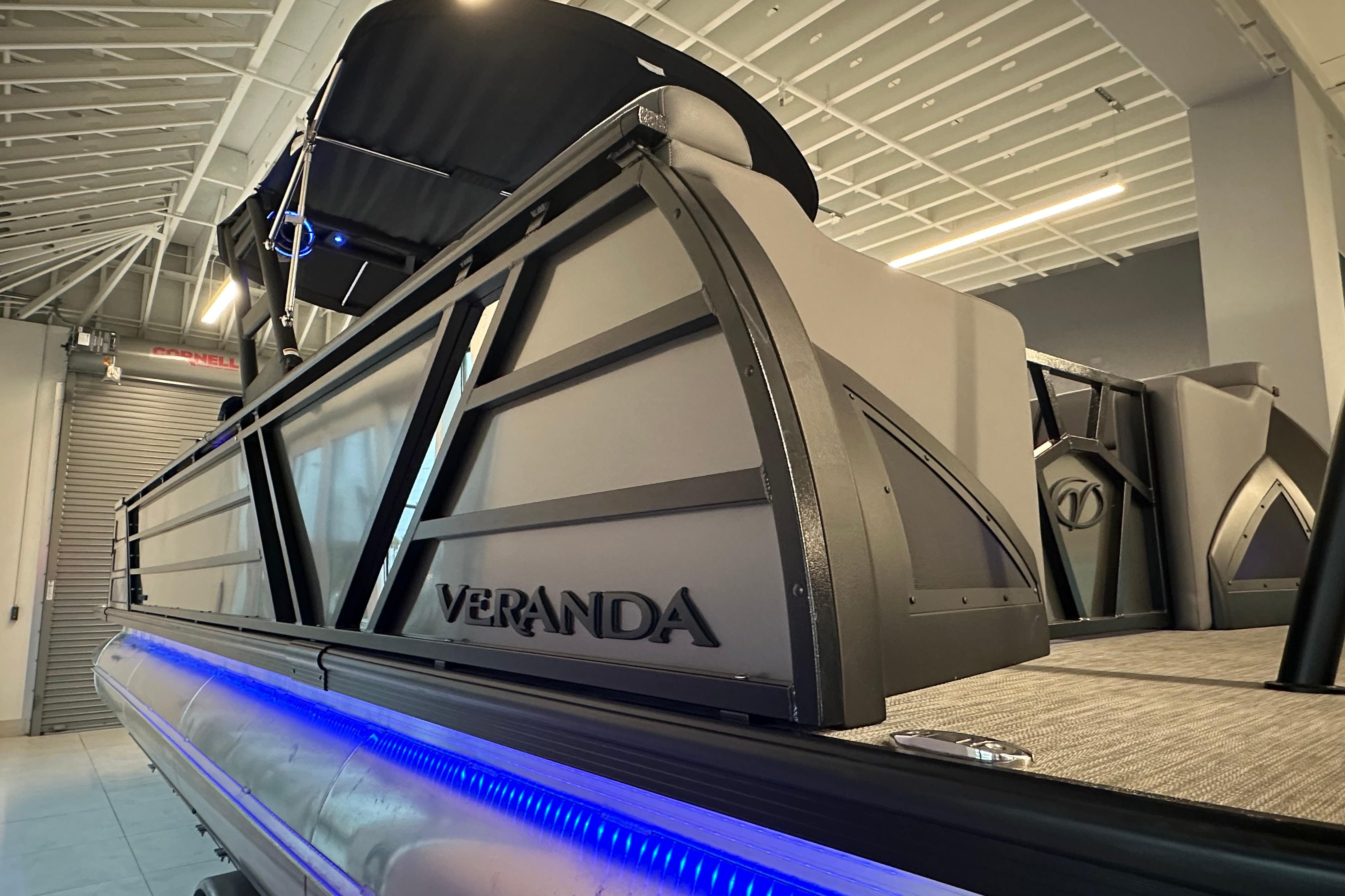 2025 Veranda VX 27 DCRC pontoon boat with sleek design and blue LED lighting.
