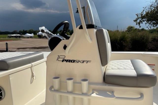 2026 Mako 18 Pro Skiff boat interior with seating and steering console.