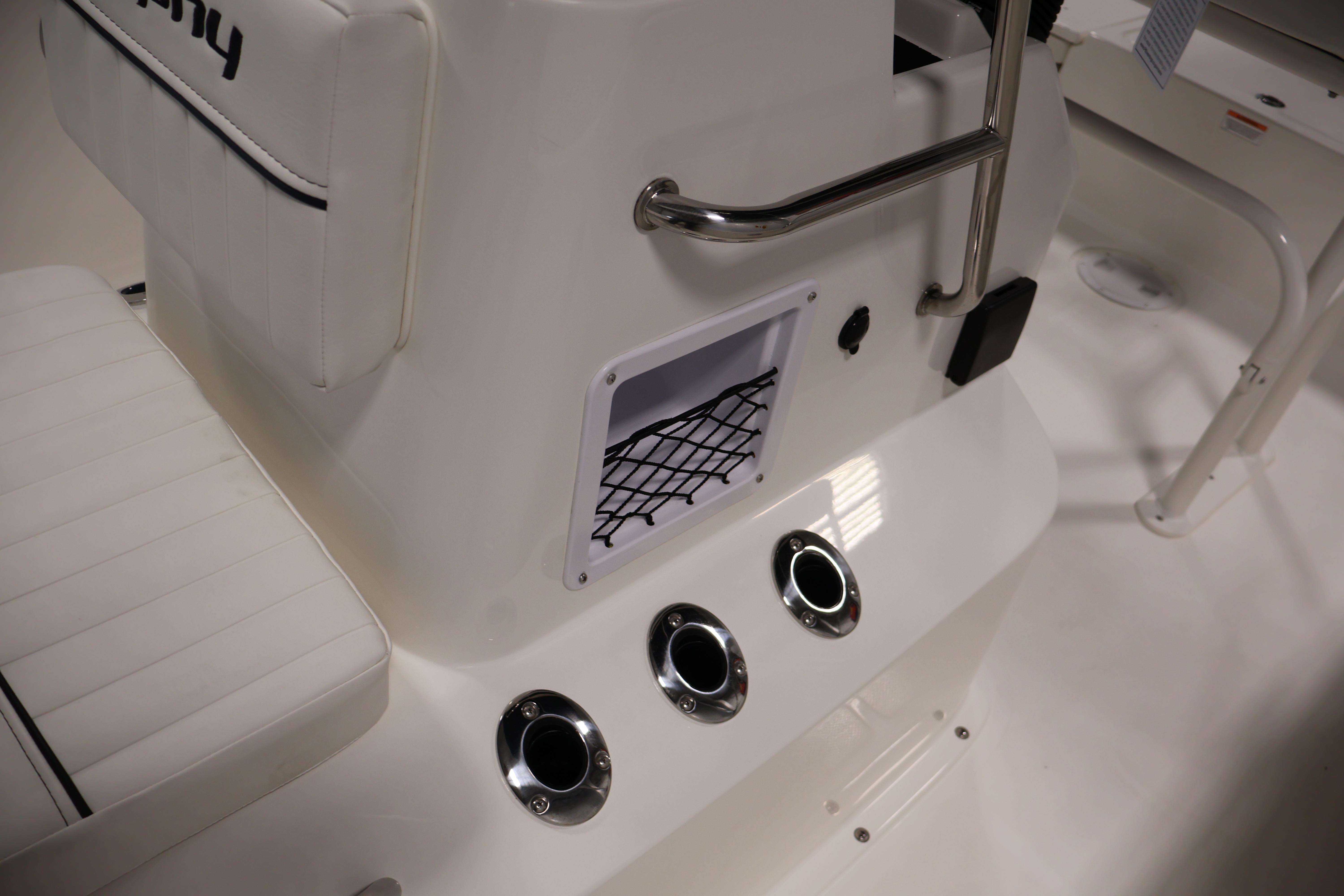Interior view of 2026 Bayliner Trophy T18 boat, featuring seating and storage compartments.