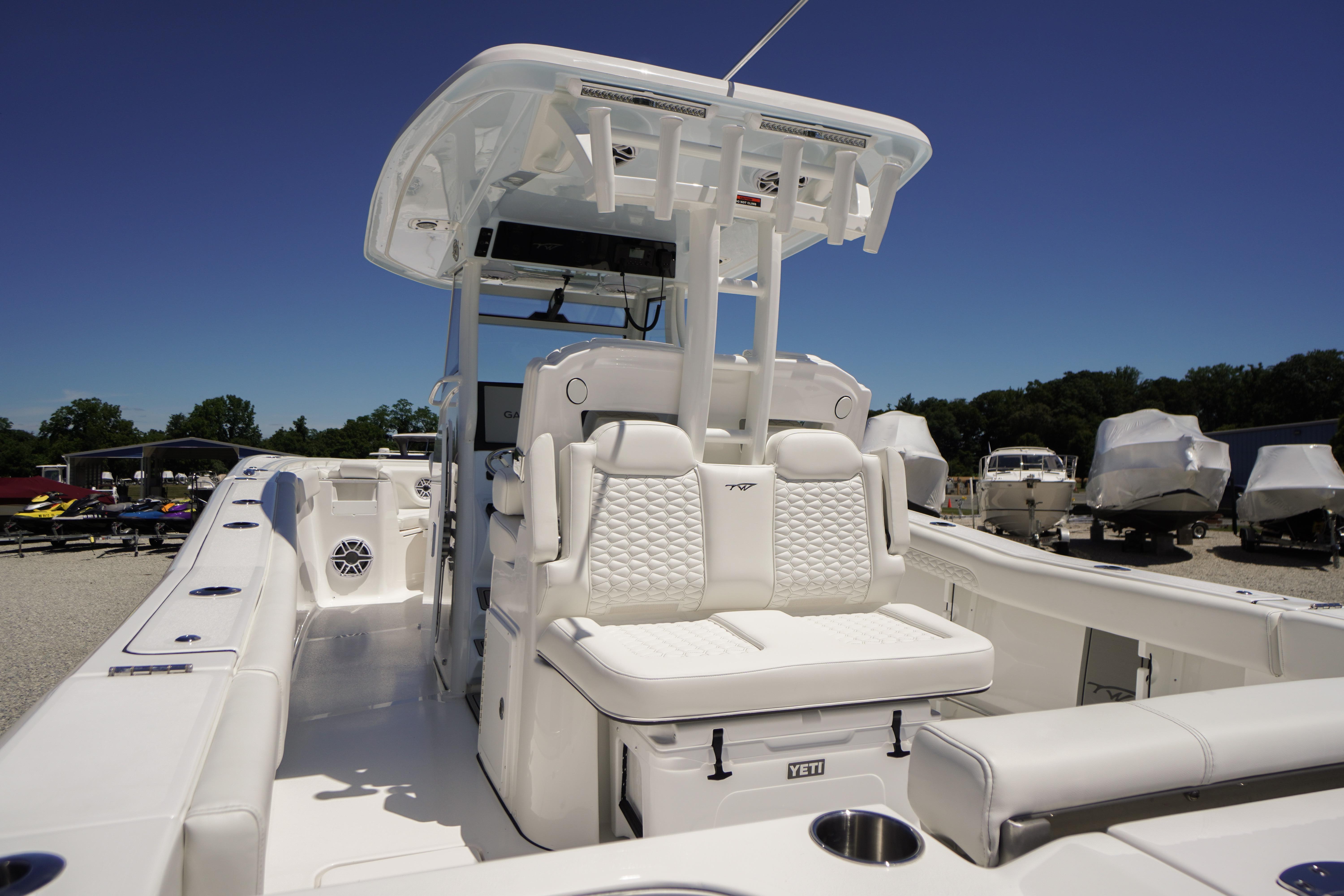 2026 Tidewater 302 CC Adventure boat interior with white seating and modern design.