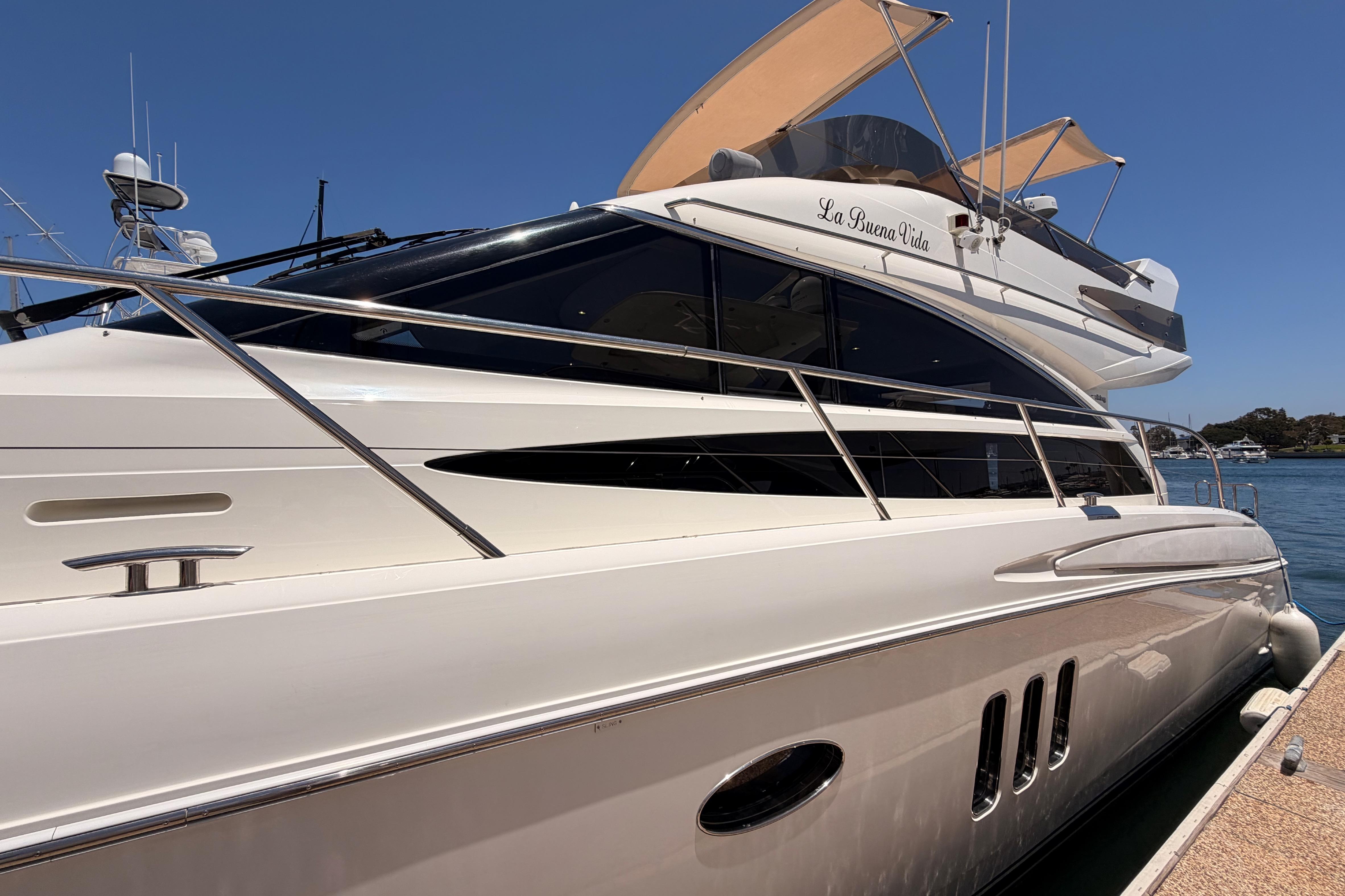 2007 Viking Princess 54 Flybridge yacht docked, featuring sleek design and luxurious amenities.