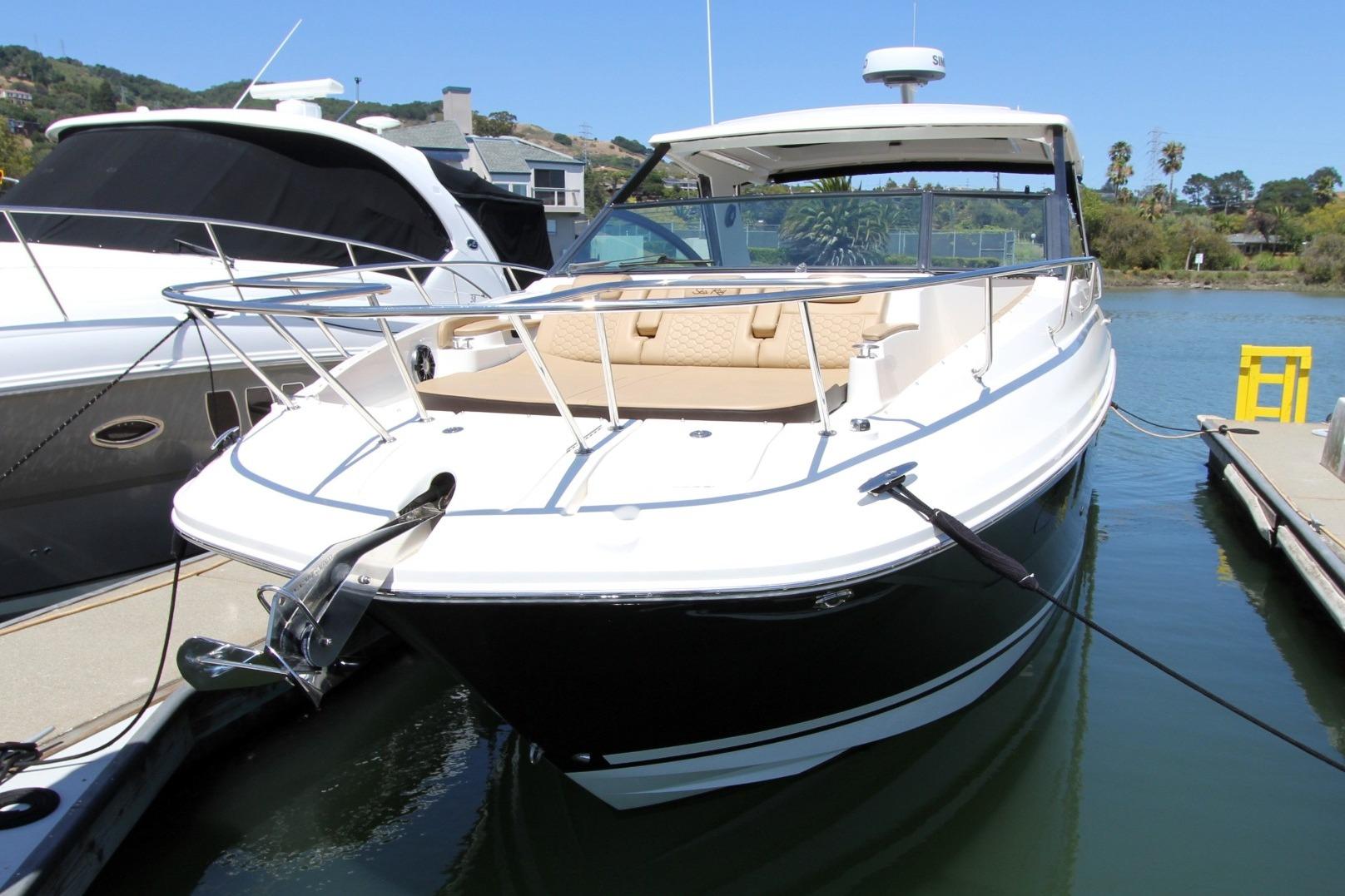 2021 Sea Ray Sundancer 320 Outboard docked, showcasing sleek design and luxurious seating.