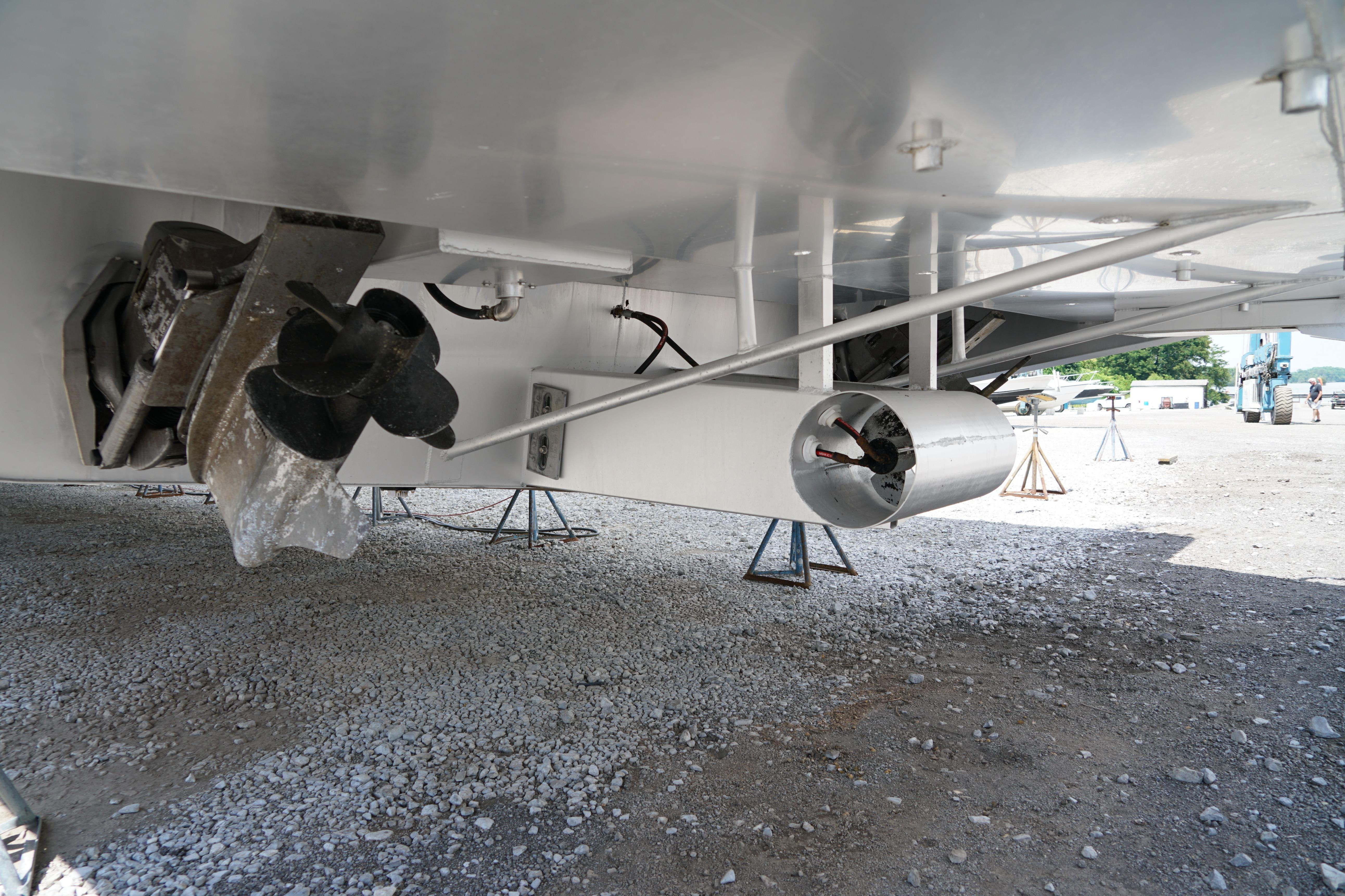 Underside view of 2000 Stardust Cruisers 83'x17' boat with visible propeller and rudder.