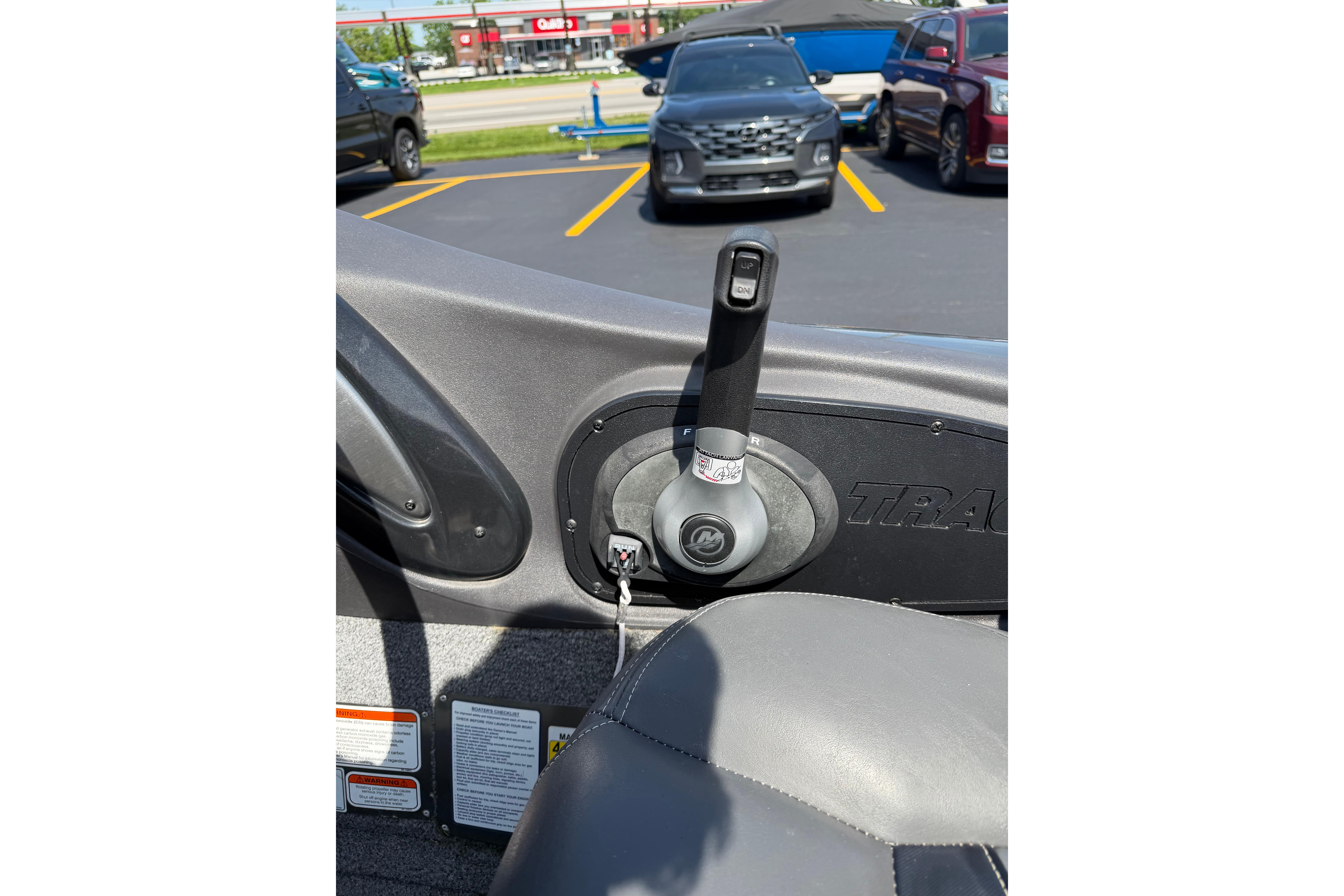 2019 Tracker Pro Team 175 TF boat throttle control in parking lot.