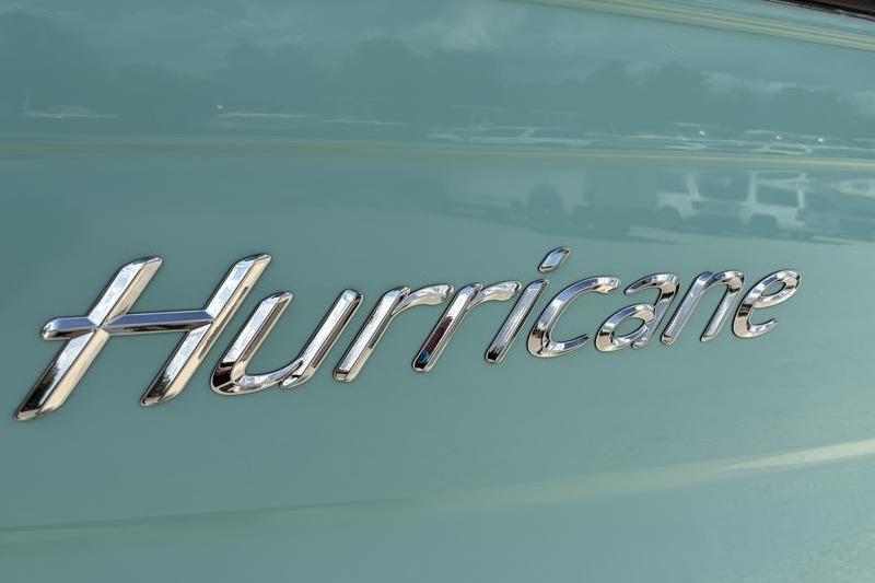Chrome "Hurricane" logo on 2026 SunDeck Sport 2050 OB boat.