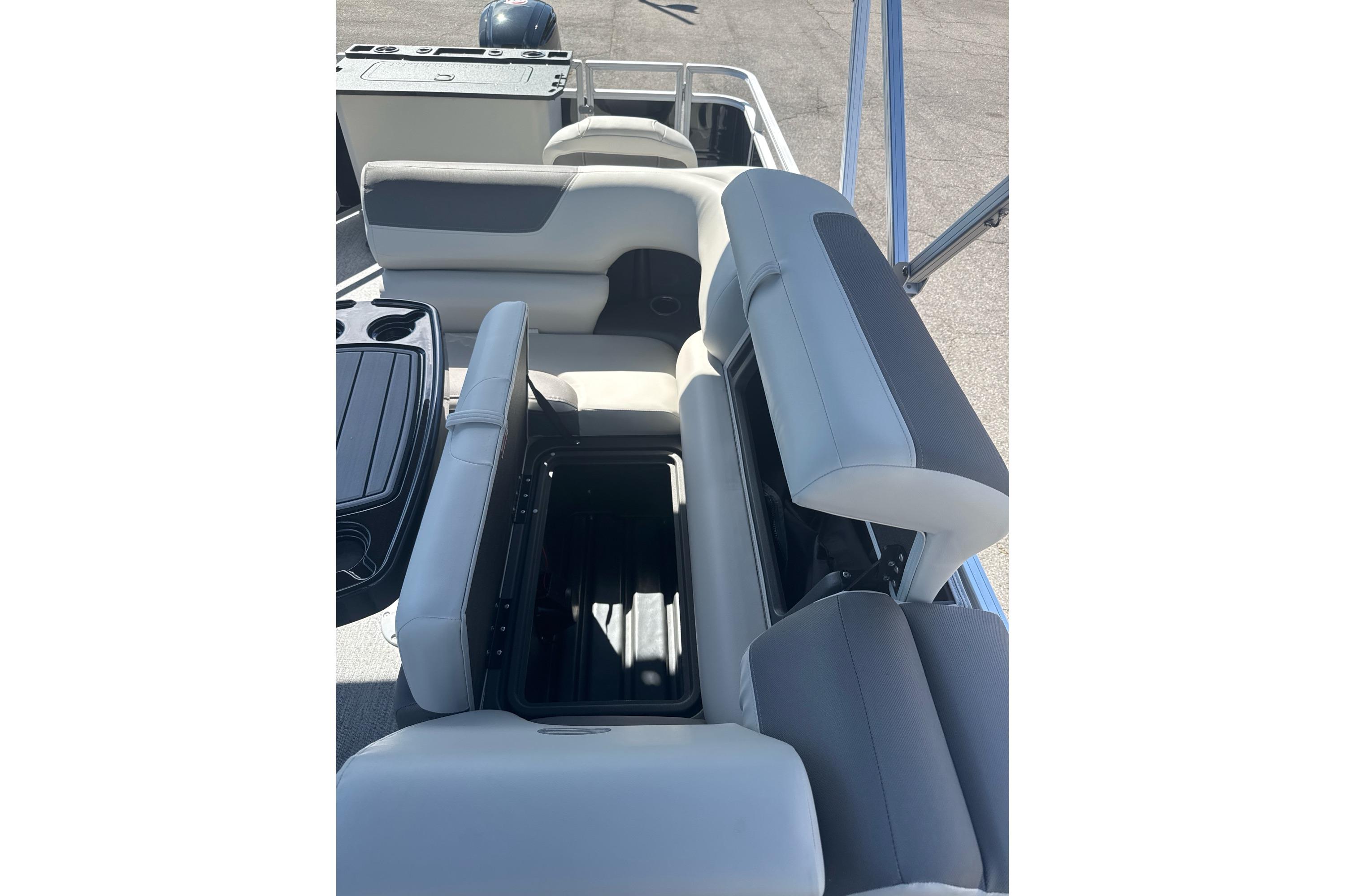 2026 Sun Tracker Fishin' Barge 20 DLX interior seating and storage view.