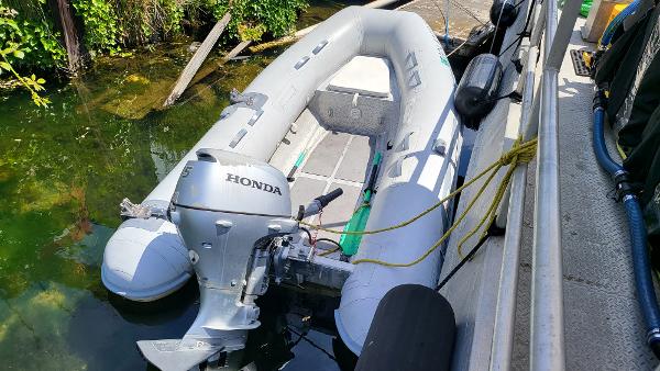 2014 AB Inflatables Lamina 10 with Honda outboard motor docked.