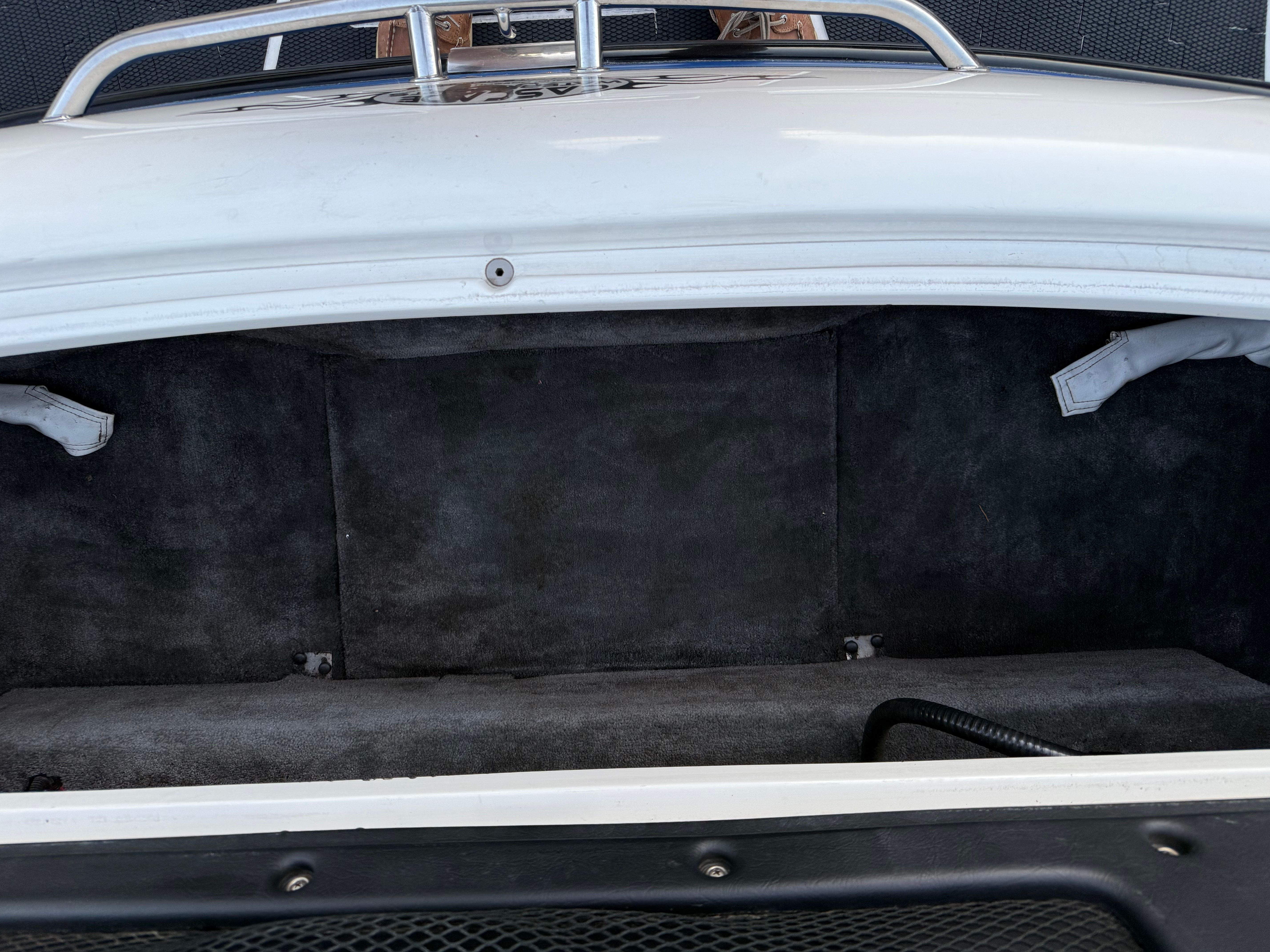 Trunk of a 2004 MB Sports 220 car, empty and clean.