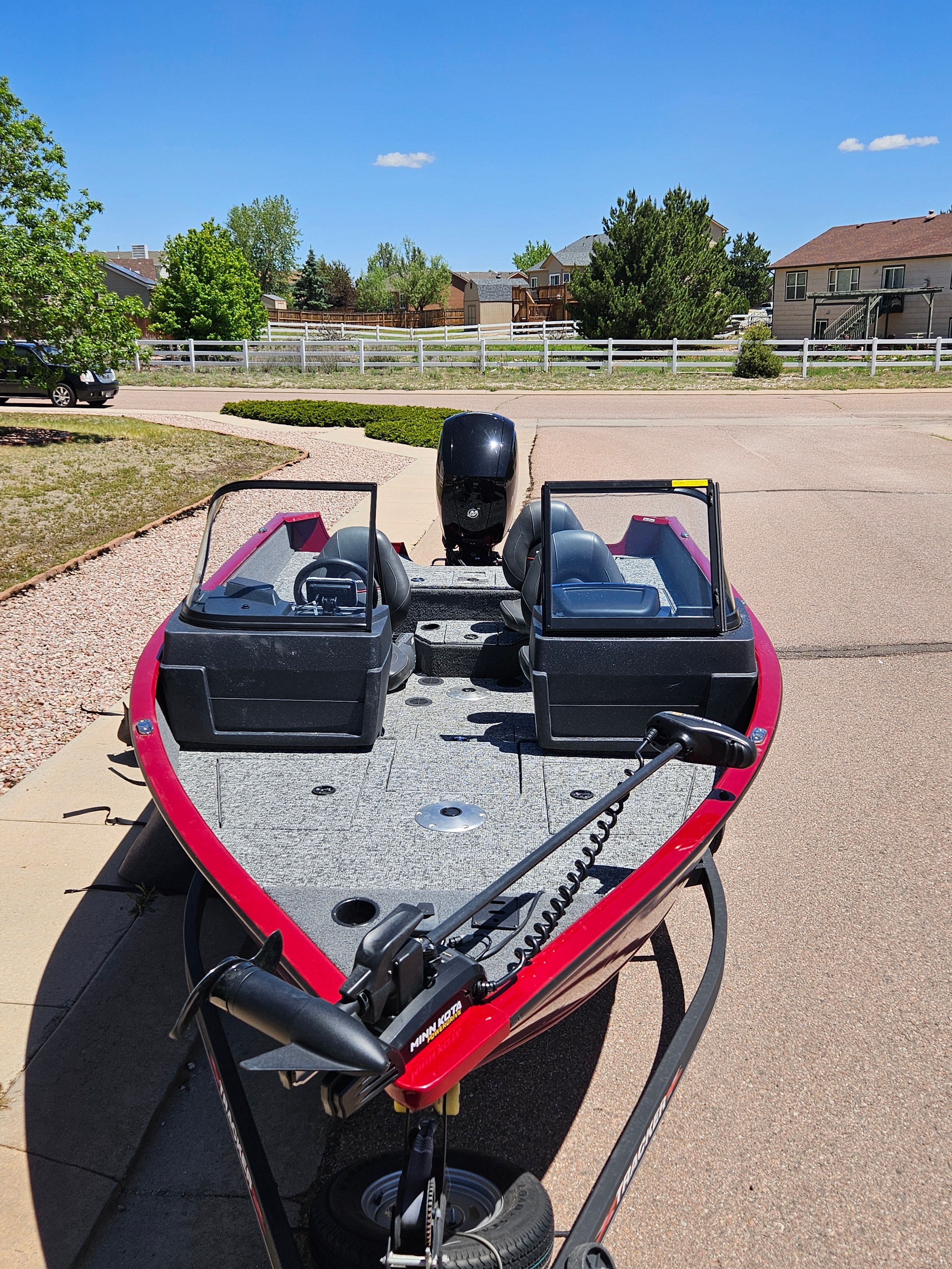 2021 Tracker Pro Guide V-175 WT boat on trailer in residential area.