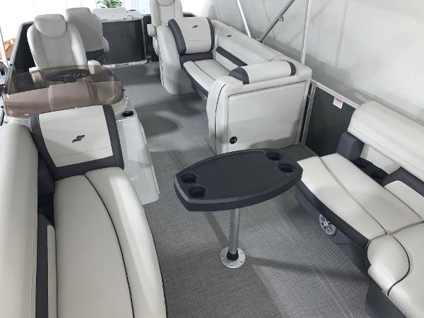 2024 Starcraft EX22 FD boat interior with luxurious seating and table.