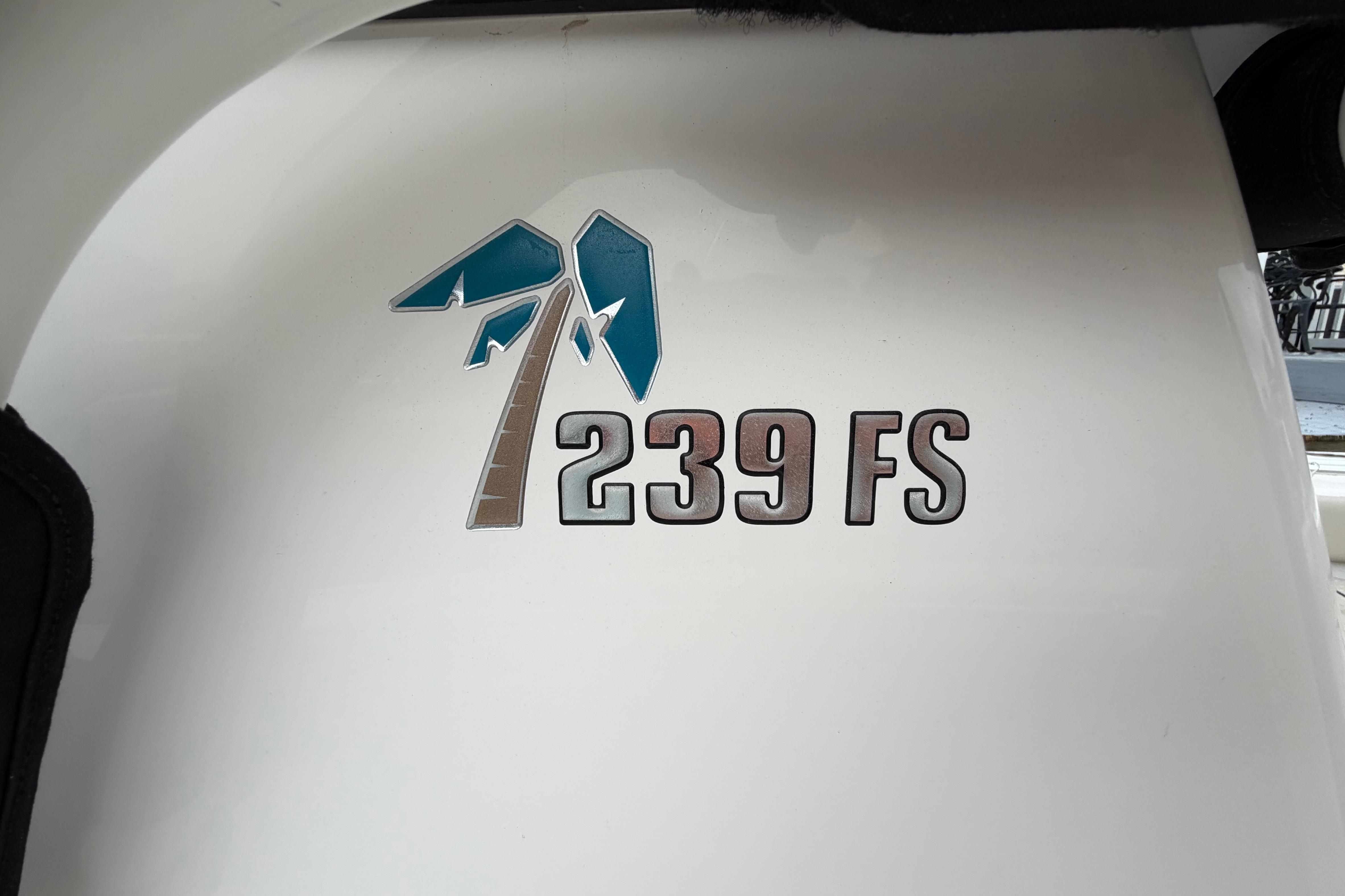 Key West 239 FS 2022 boat logo on white surface.