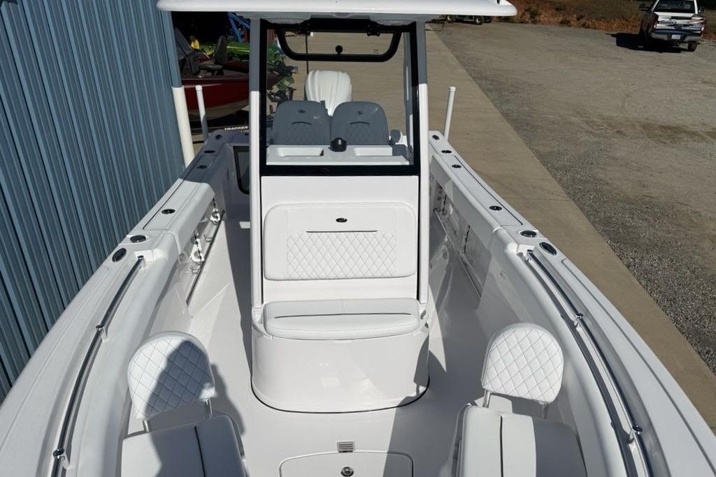2026 Sportsman Open 232 Center Console boat with sleek white interior design.